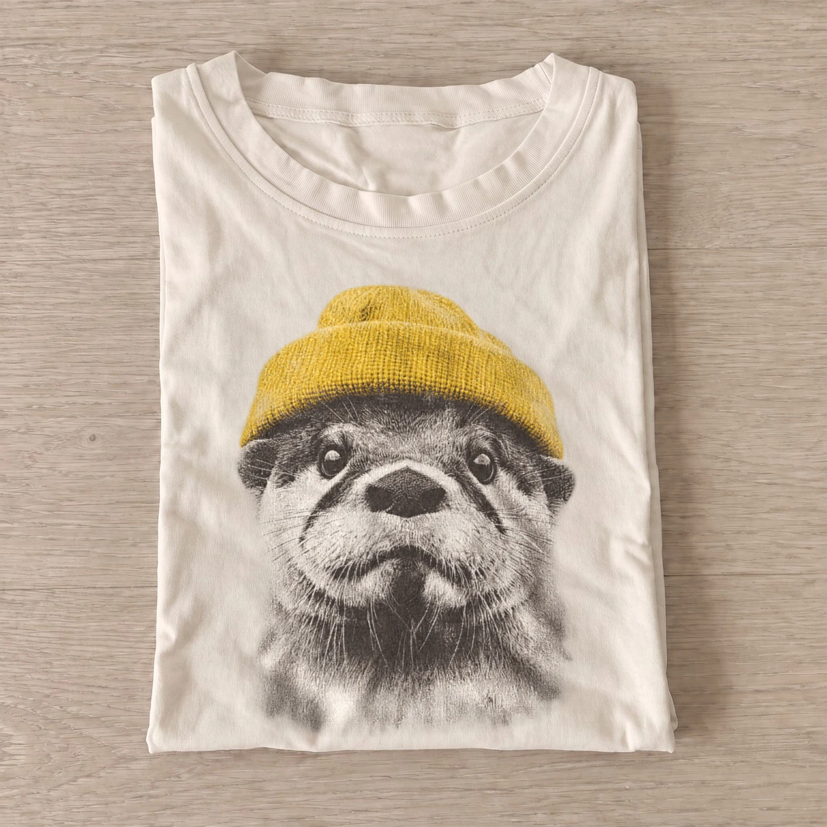 Beanie otter graphic t shirt sand20beanie otter.webp