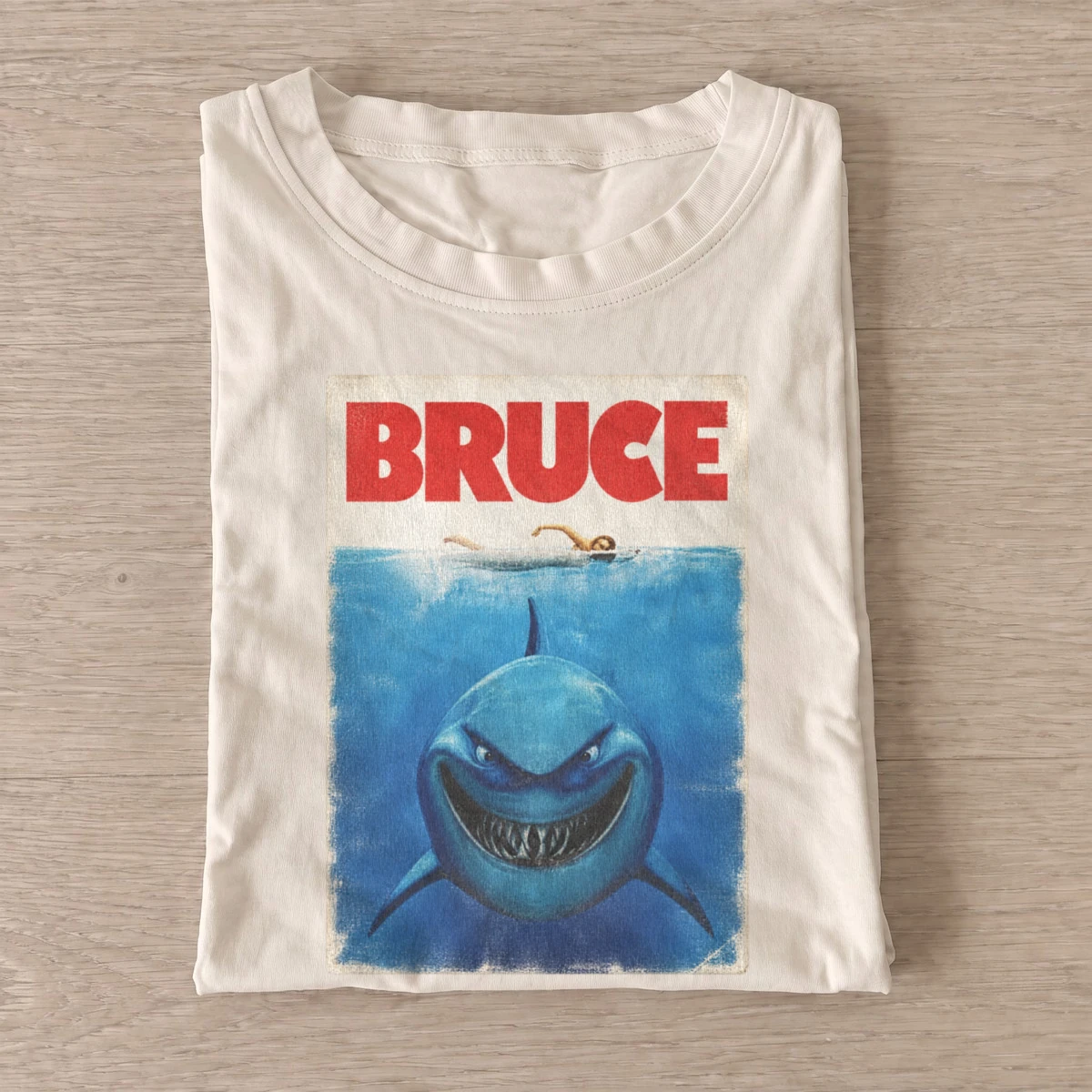 Bruce grinning shark graphic t shirt sand20grinning shark.webp