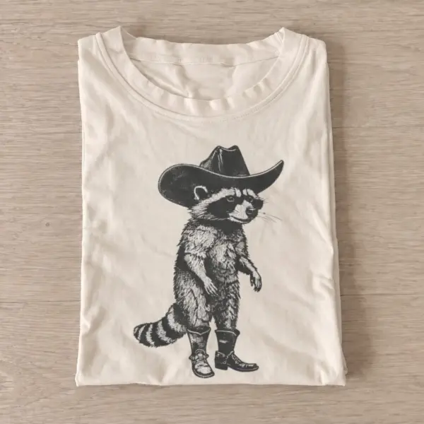 Cowboy raccoon strut t shirt sand20cowboy raccoon strut.webp