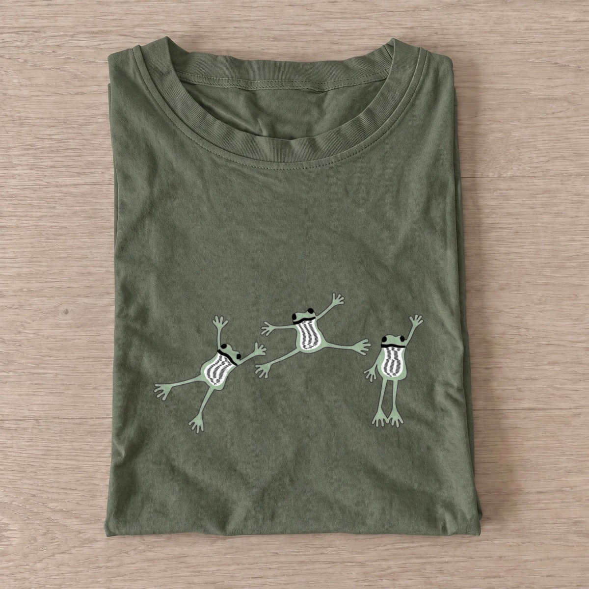 Dancing frog trio t shirt olive20dancing frog trio.webp