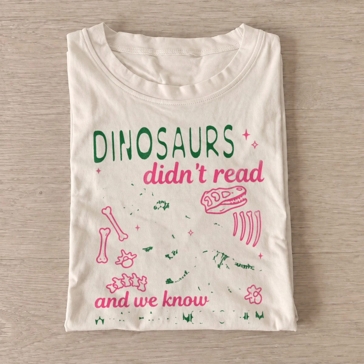 Dinosaurs didnt read graphic t shirt sand20dinosaurs didnt read.webp