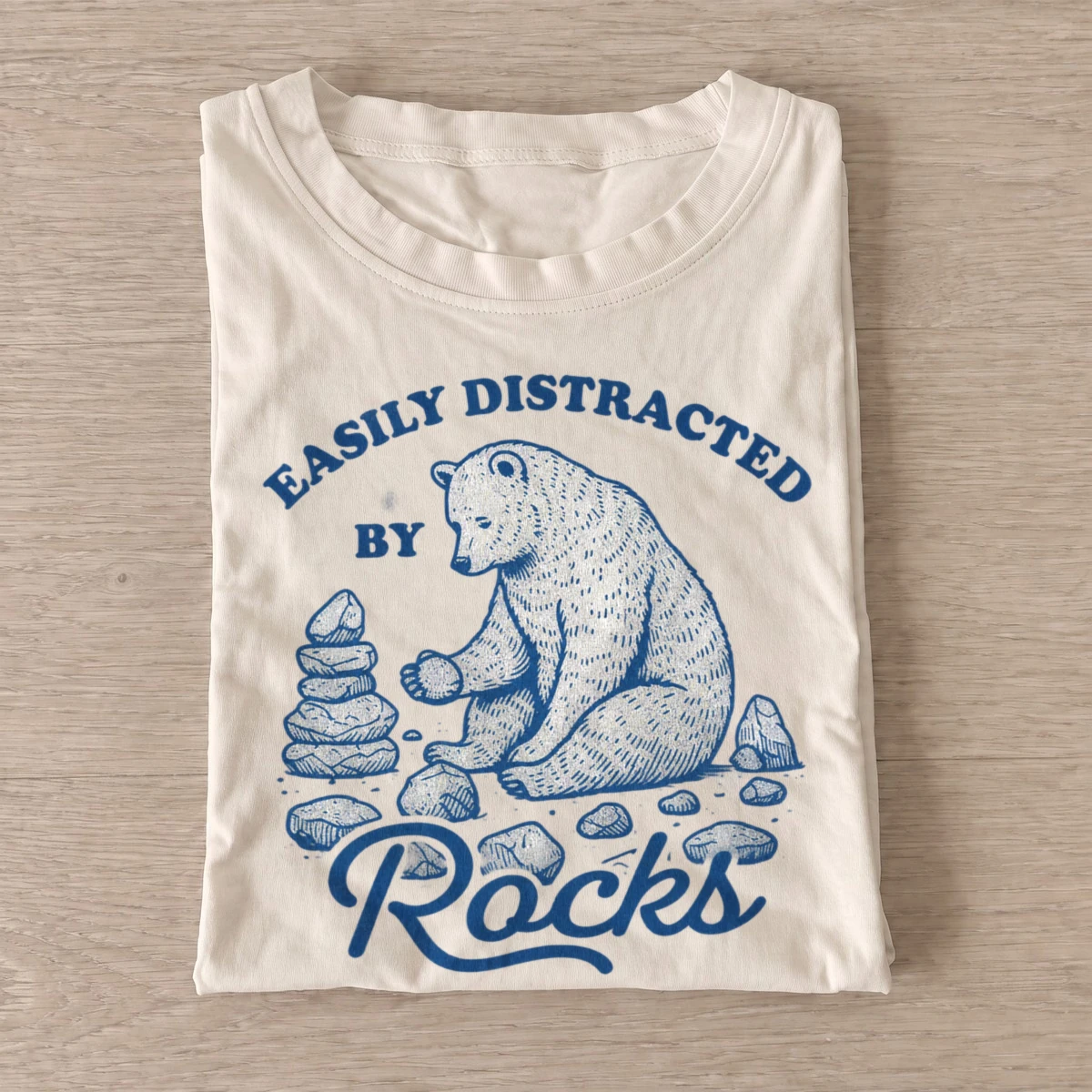 Easily distracted by rocks bear t shirt sand20rock distracted bear.webp