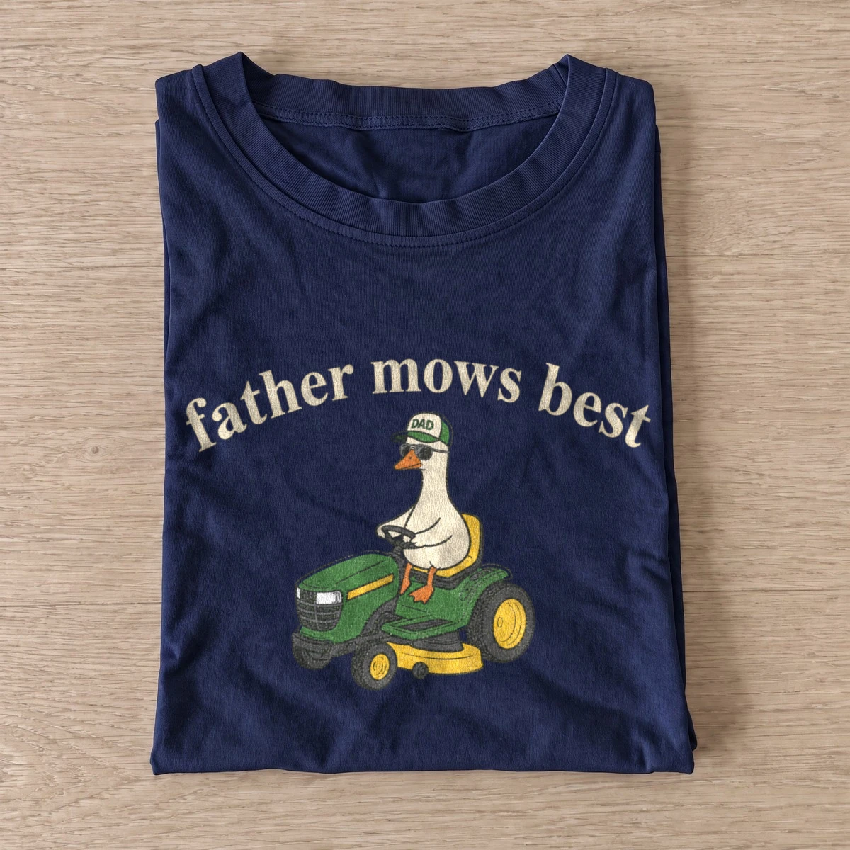 Father mows best lawn mower goose t shirt navy20mower dad goose.webp