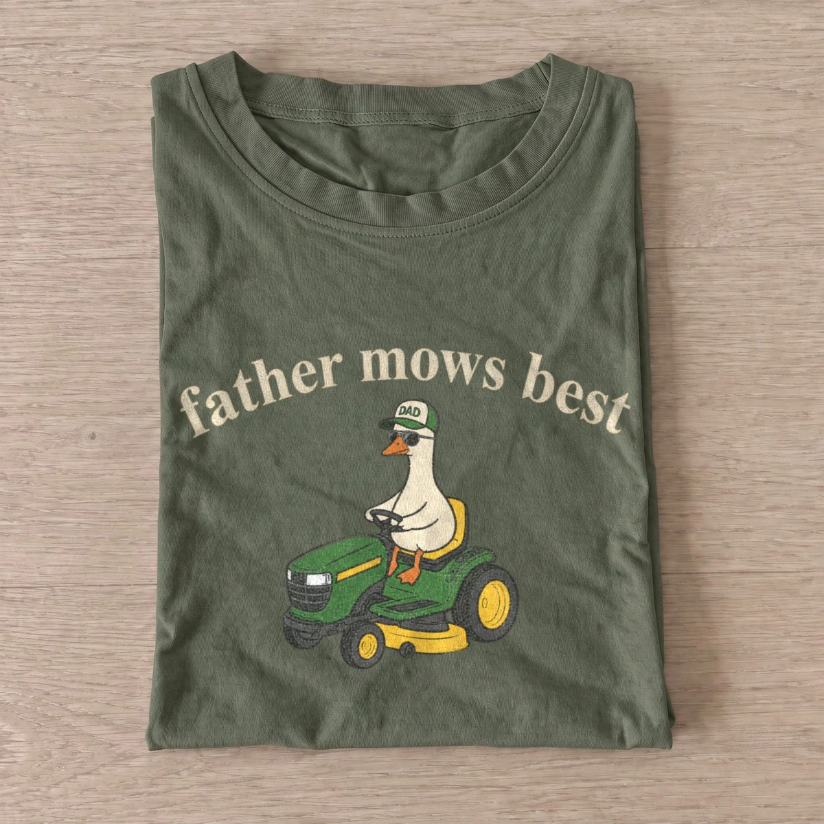 Father mows best lawn mower goose t shirt olive20mower dad goose.webp
