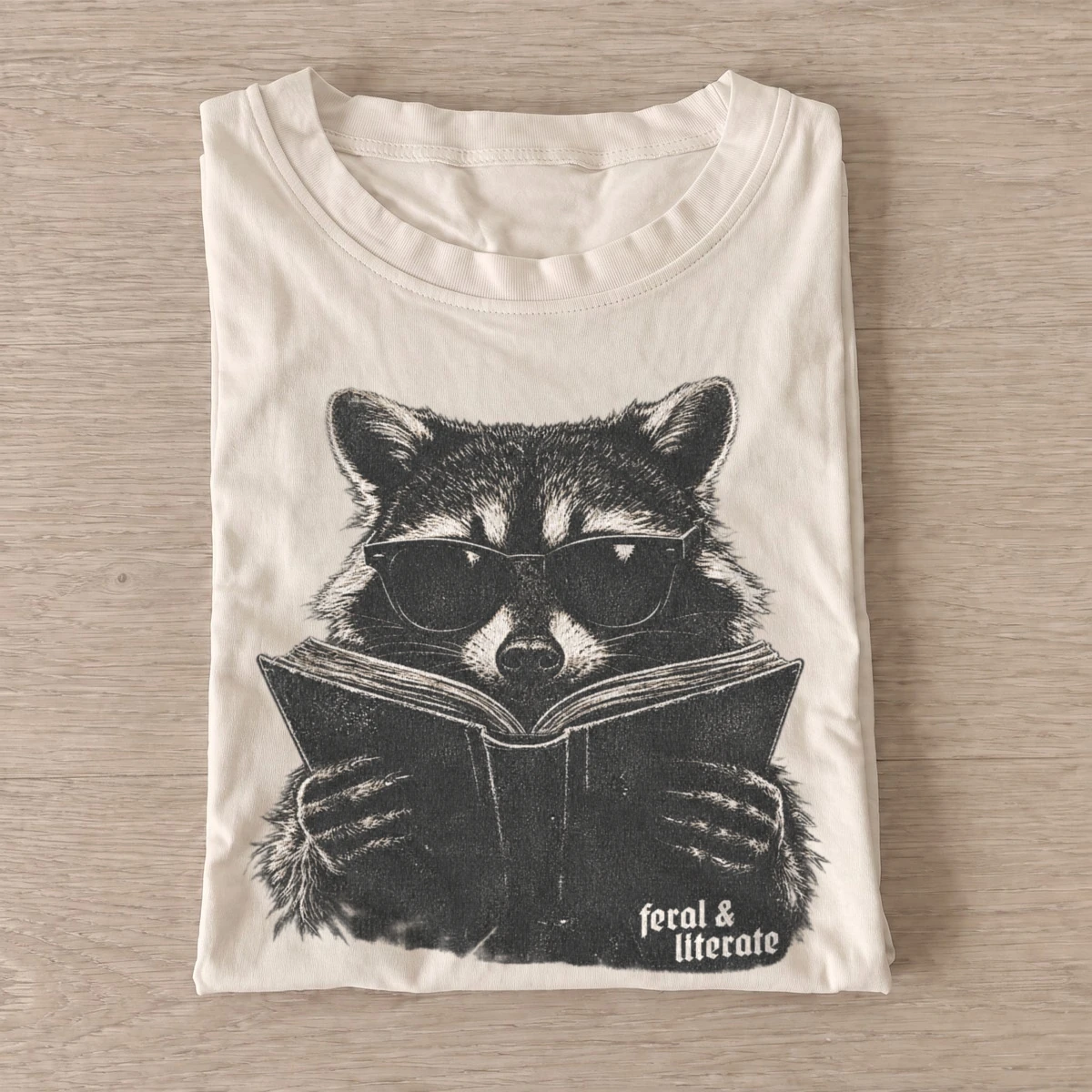 Feral literate reading raccoon t shirt sand20feral literate raccoon.webp
