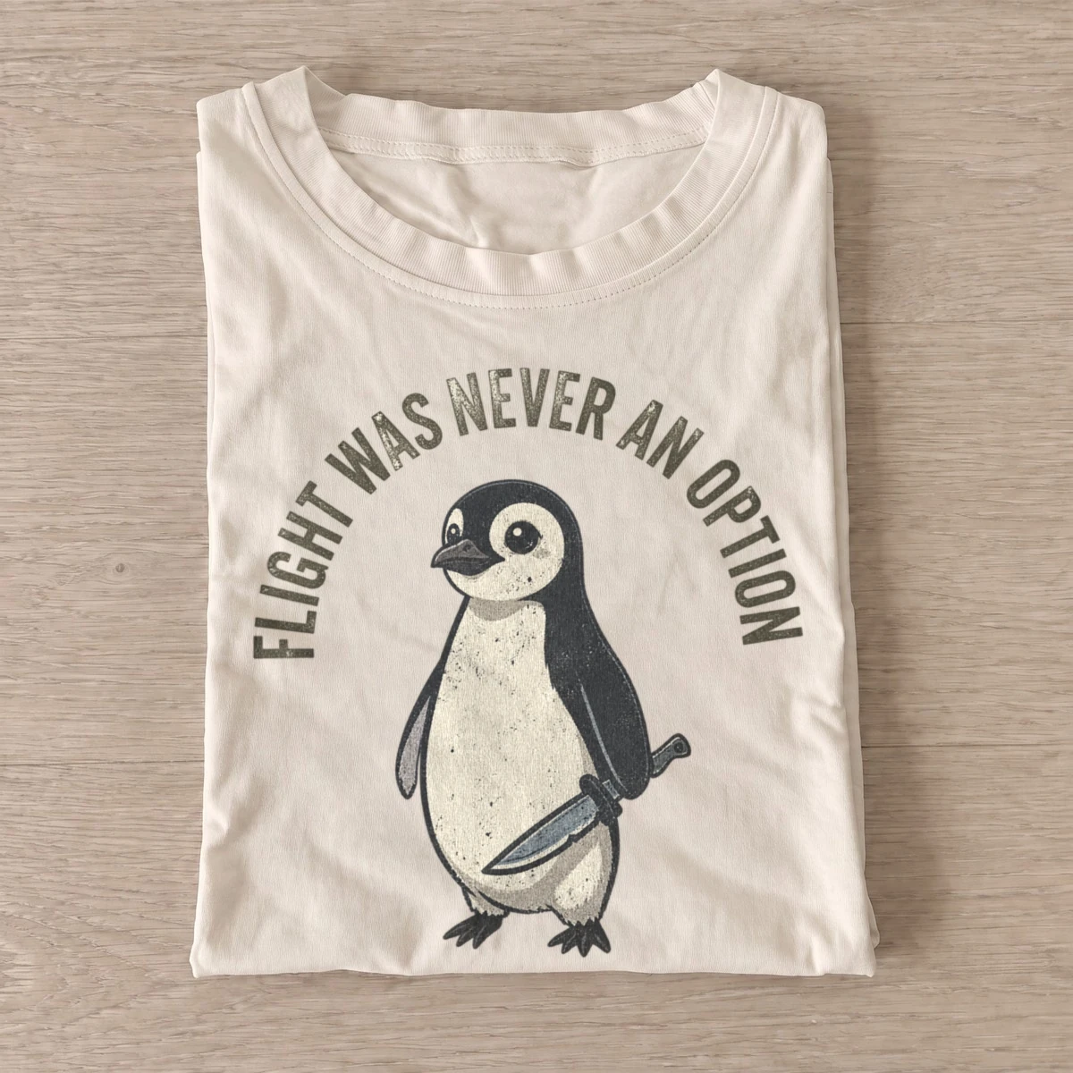 Flight was never an option knife penguin t shirt sand20flightless knife penguin.webp