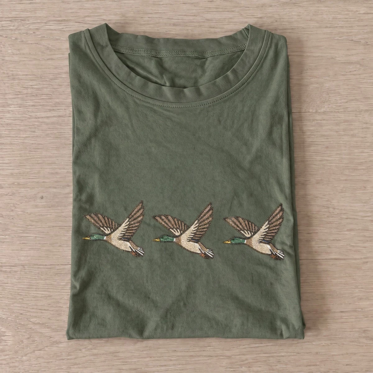 Flying duck trio t shirt olive20flying duck trio.webp