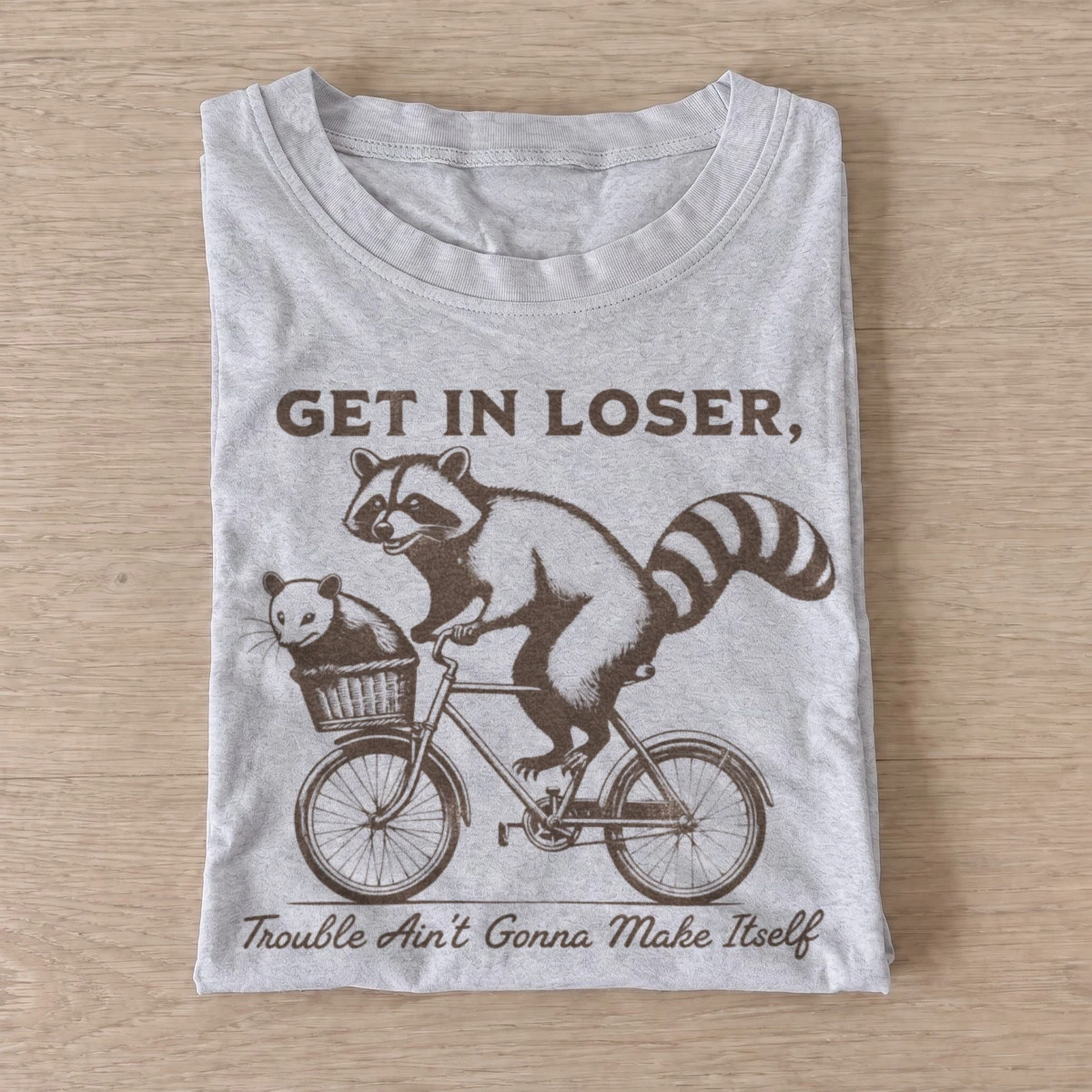 Get in loser trouble bicycle raccoon t shirt gray20trouble bicycle raccoons.webp
