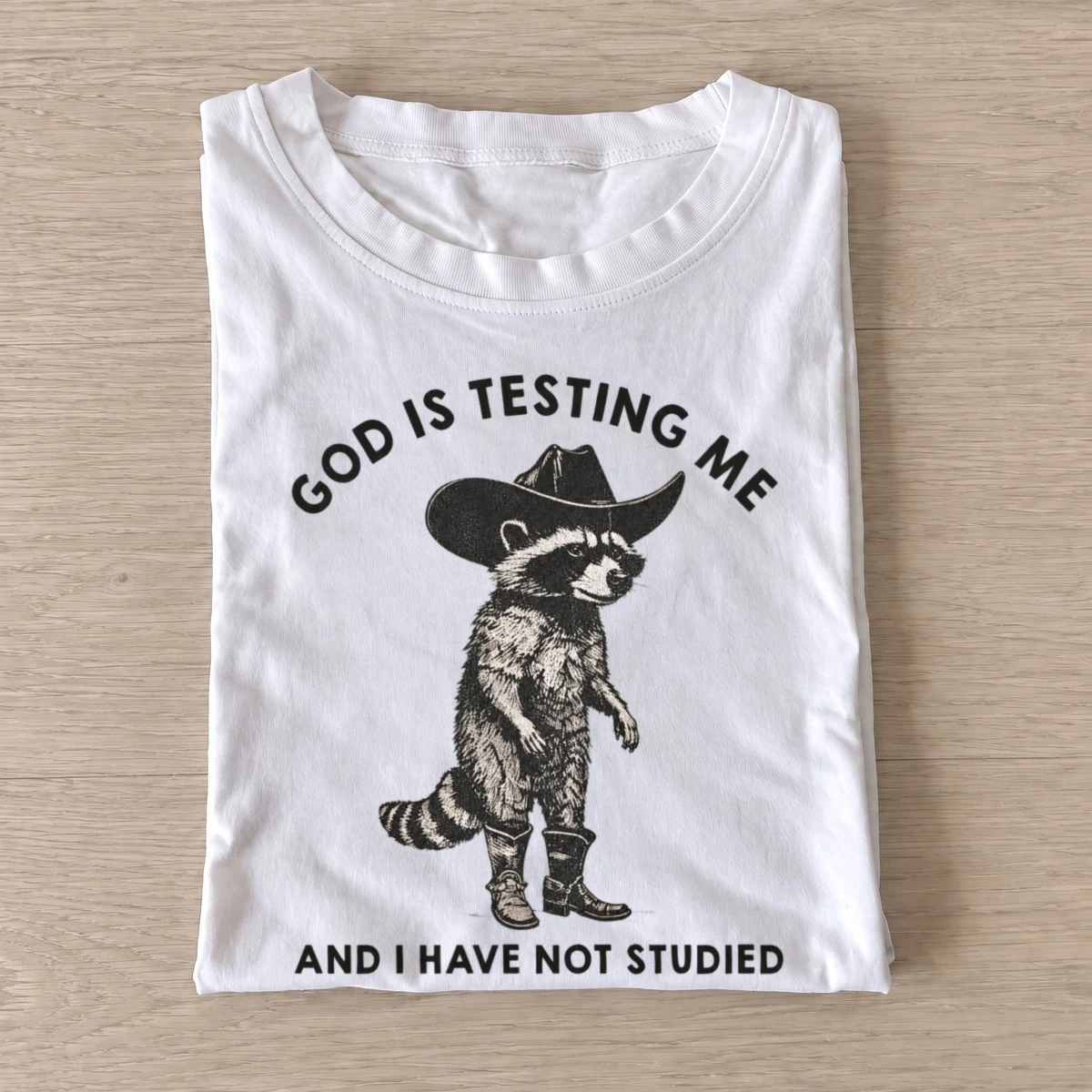 God is testing me cowboy raccoon t shirt white20god tests raccoon.webp