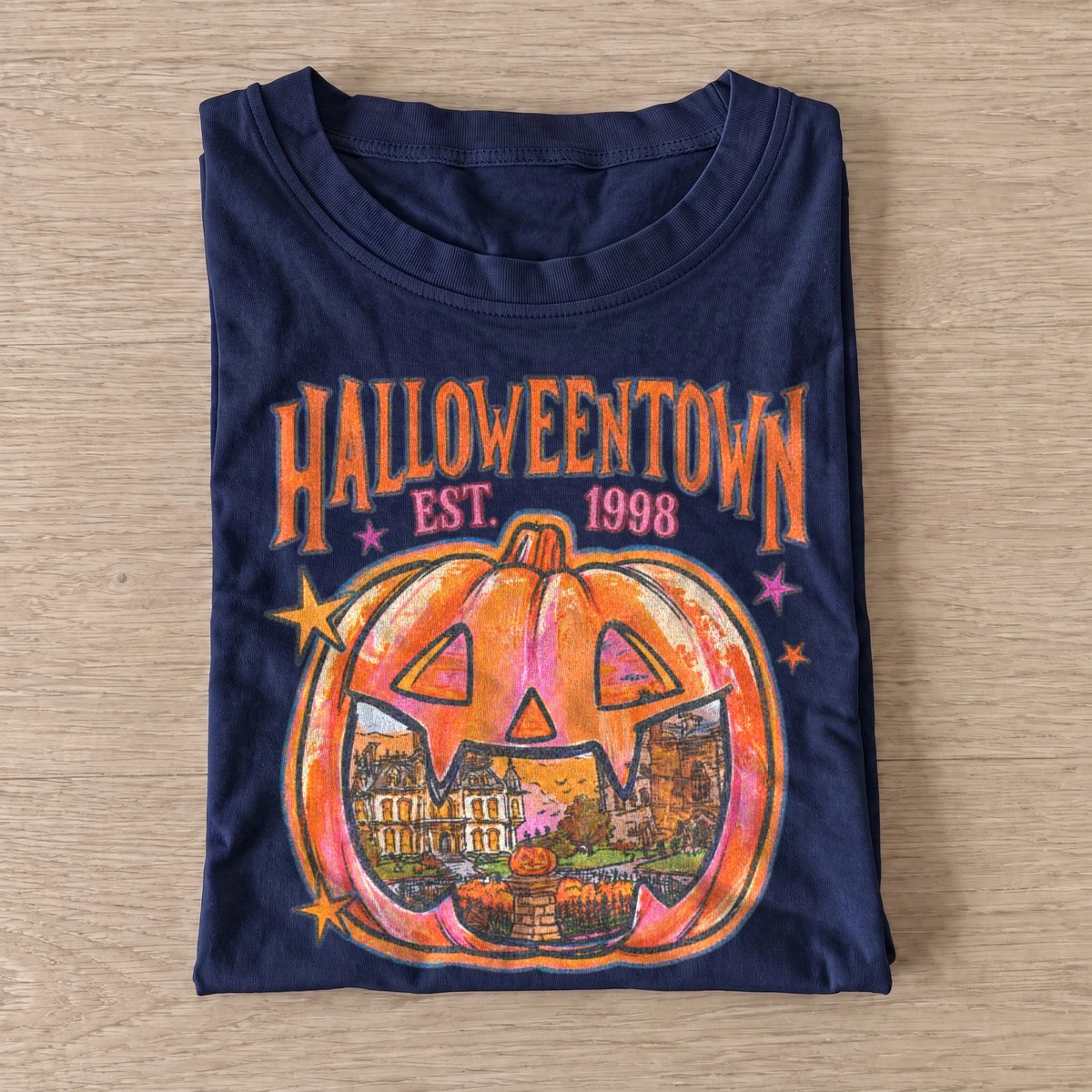 Halloweentown est 1998 pumpkin badge t shirt navy20pumpkin town badge.webp