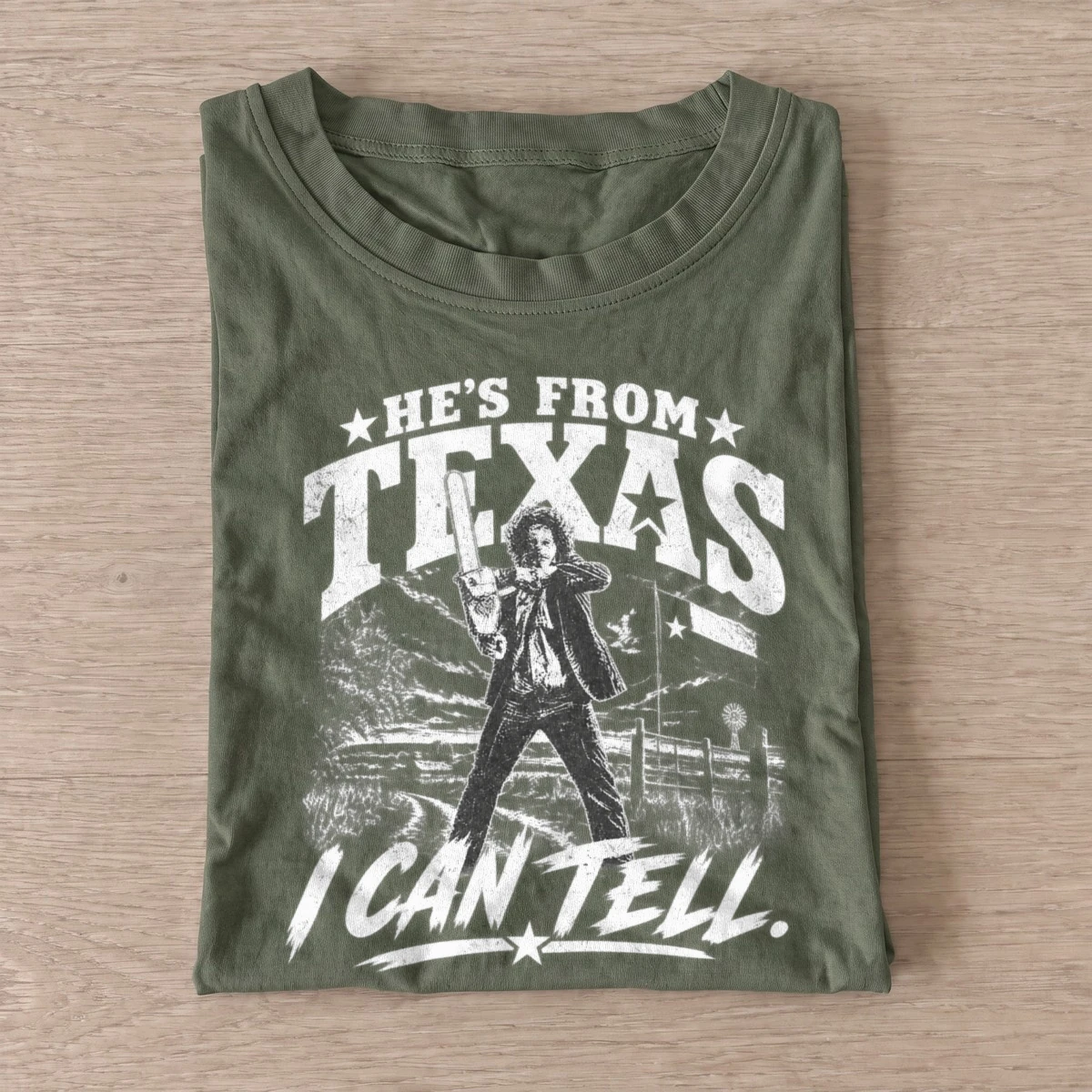 Hes from texas chainsaw killer t shirt olive20chainsaw wielding killer.webp