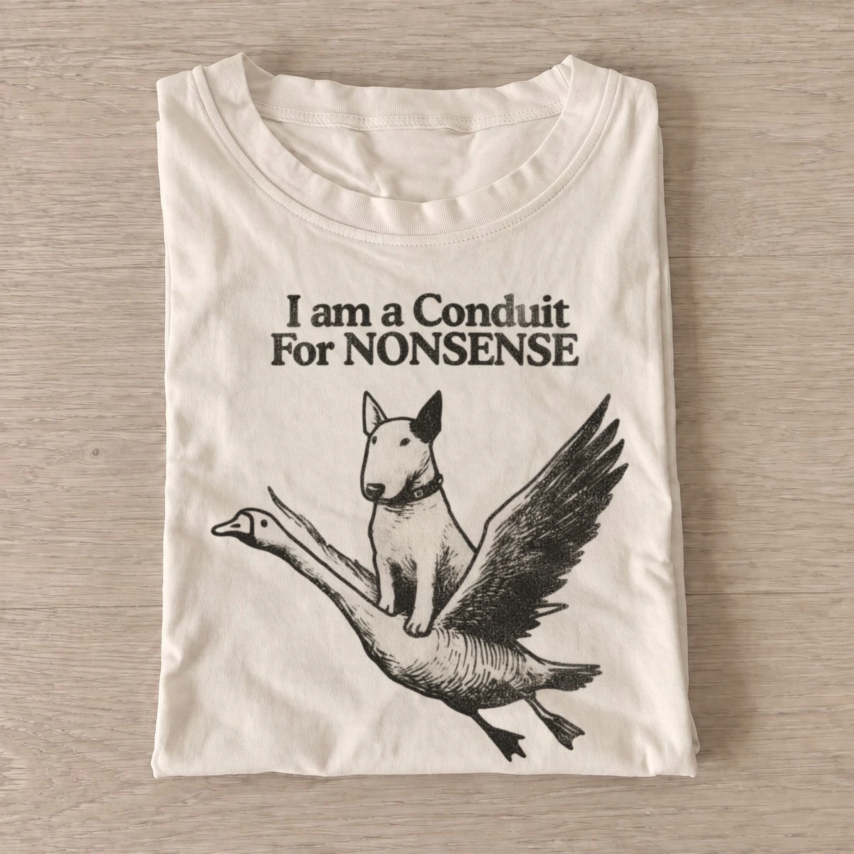 I am a conduit for nonsense dog riding goose t shirt sand20nonsense dog goose.webp