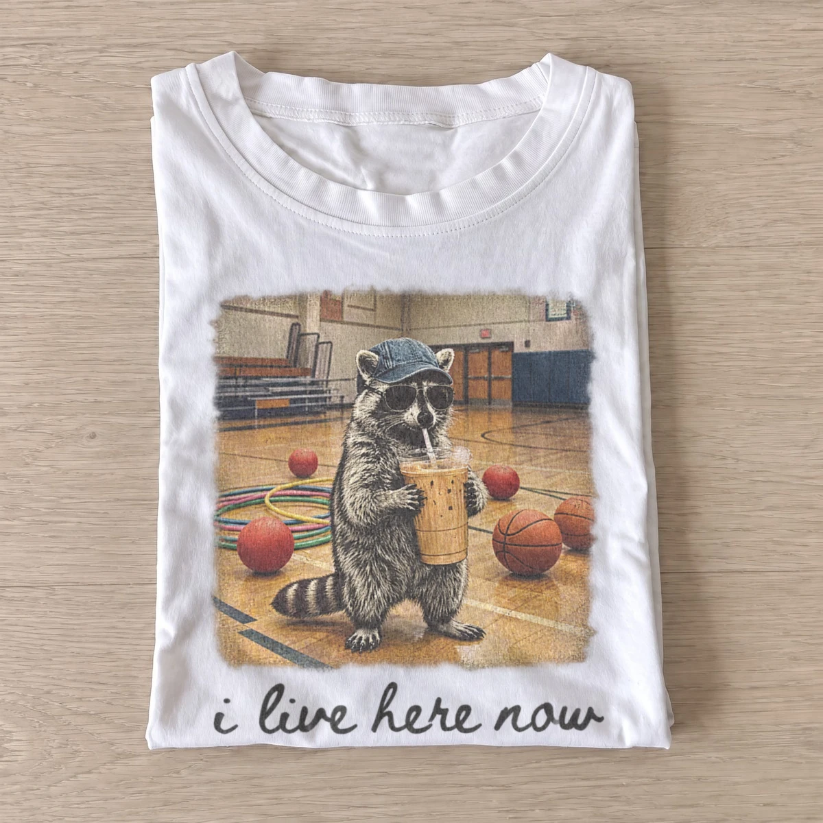 I live here now iced coffee raccoon t shirt white20iced coffee raccoon.webp