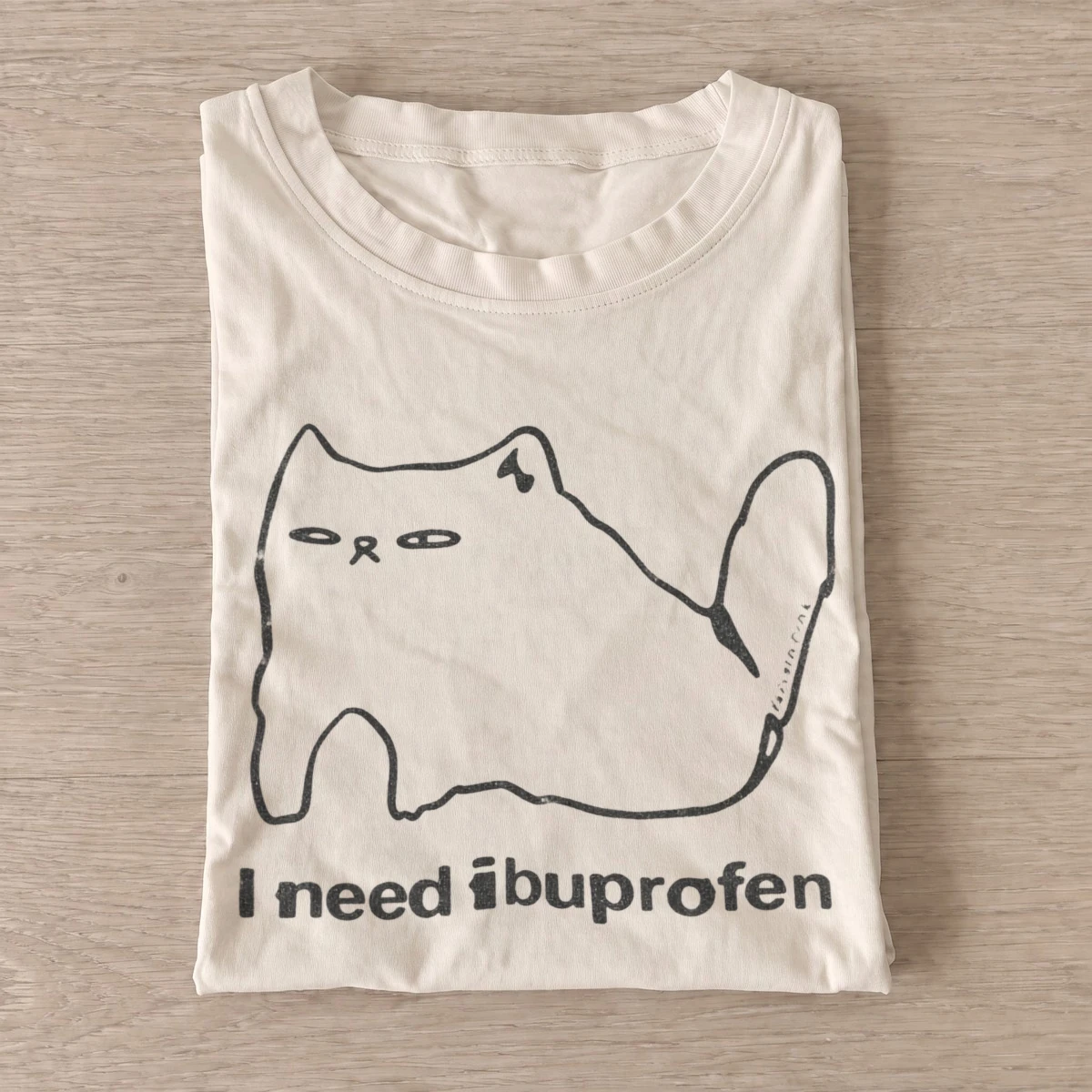 I need ibuprofen cat graphic t shirt sand20need ibuprofen cat.webp