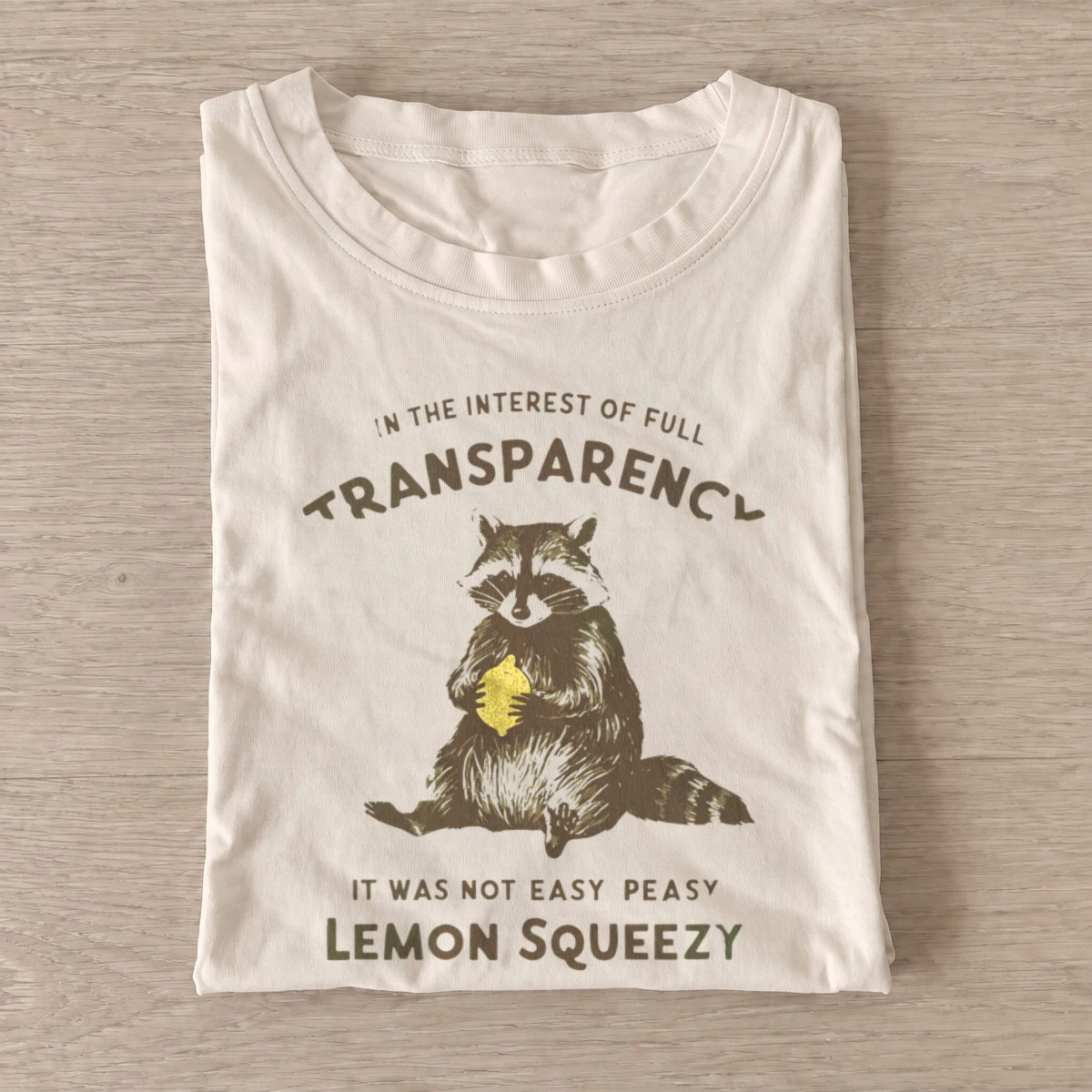 Lemon squeezy raccoon t shirt sand20lemon squeezy raccoon.webp