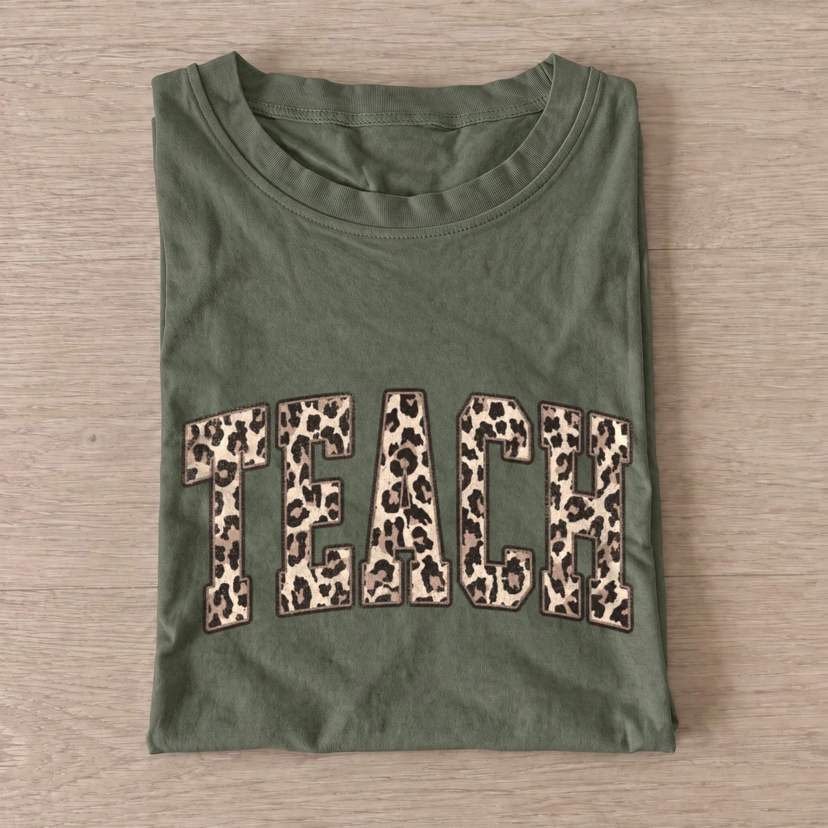 Leopard print teach t shirt olive20leopard teach.webp