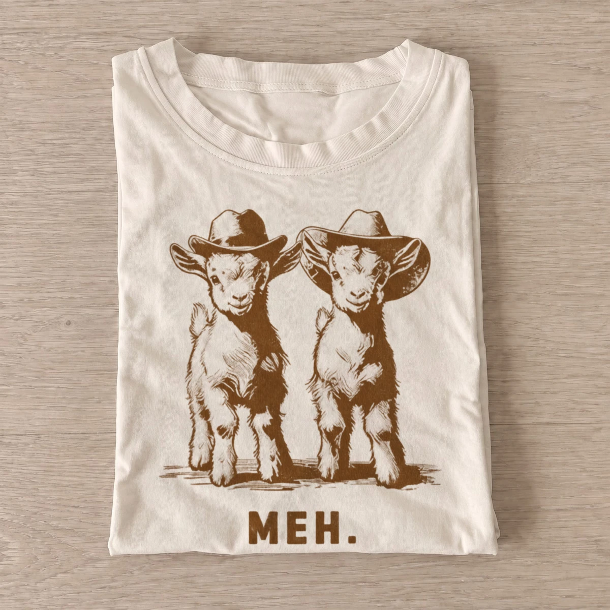 Meh cowboy goats graphic t shirt sand20meh cowboy goats.webp