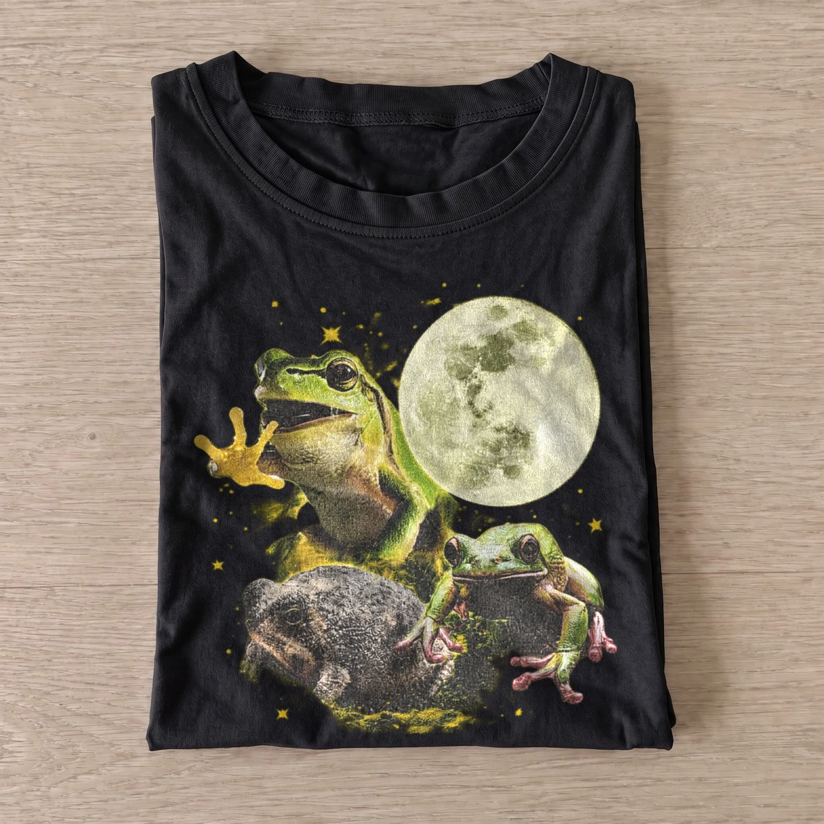 Moonlit frog trio graphic t shirt black20moonlit frog trio.webp
