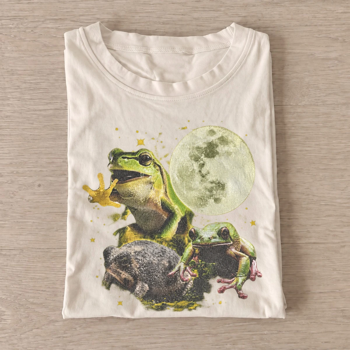 Moonlit frog trio graphic t shirt sand20moonlit frog trio.webp