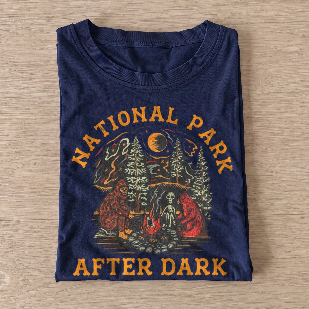 National park after dark bigfoot campfire t shirt navy20parks after dark.webp