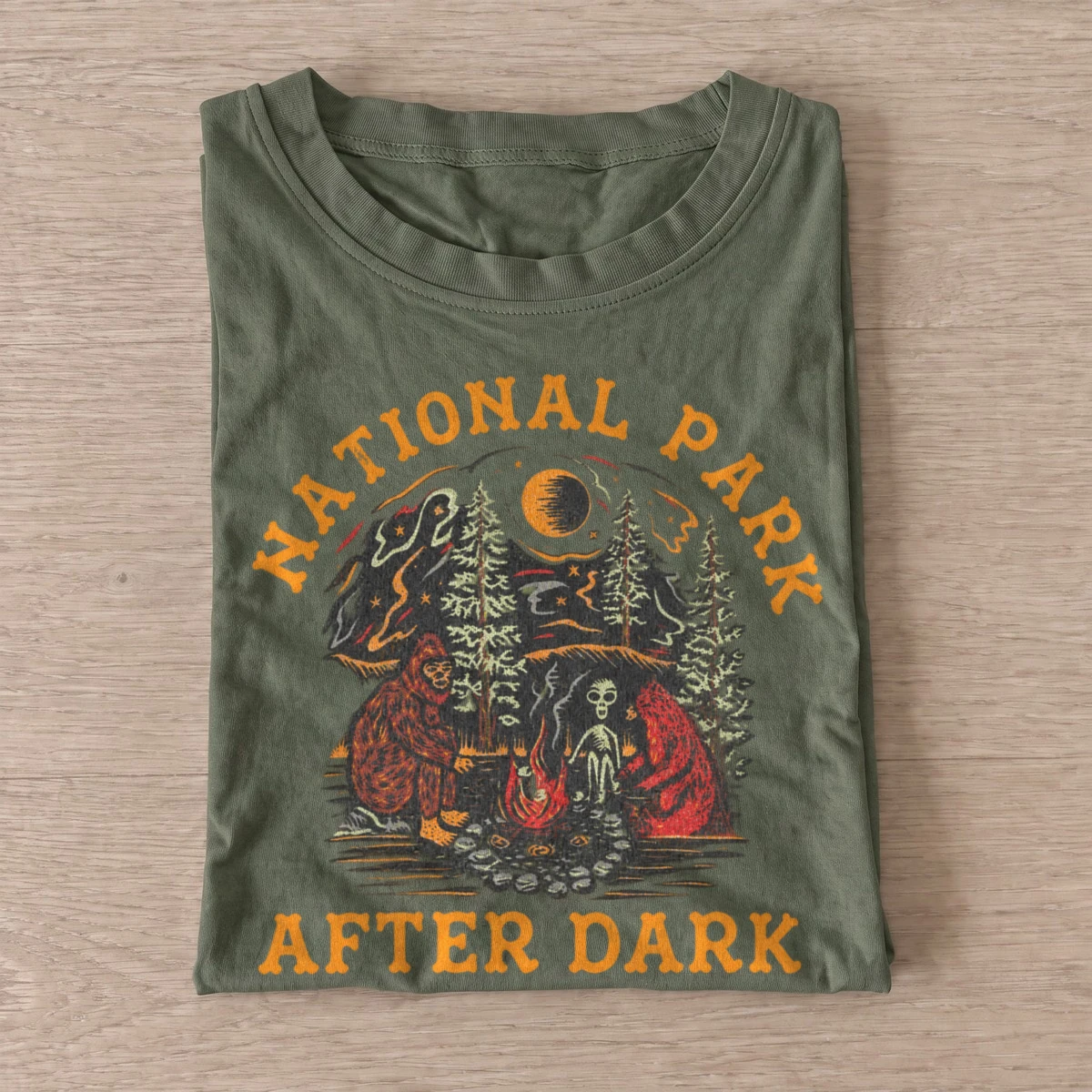 National park after dark bigfoot campfire t shirt olive20parks after dark.webp