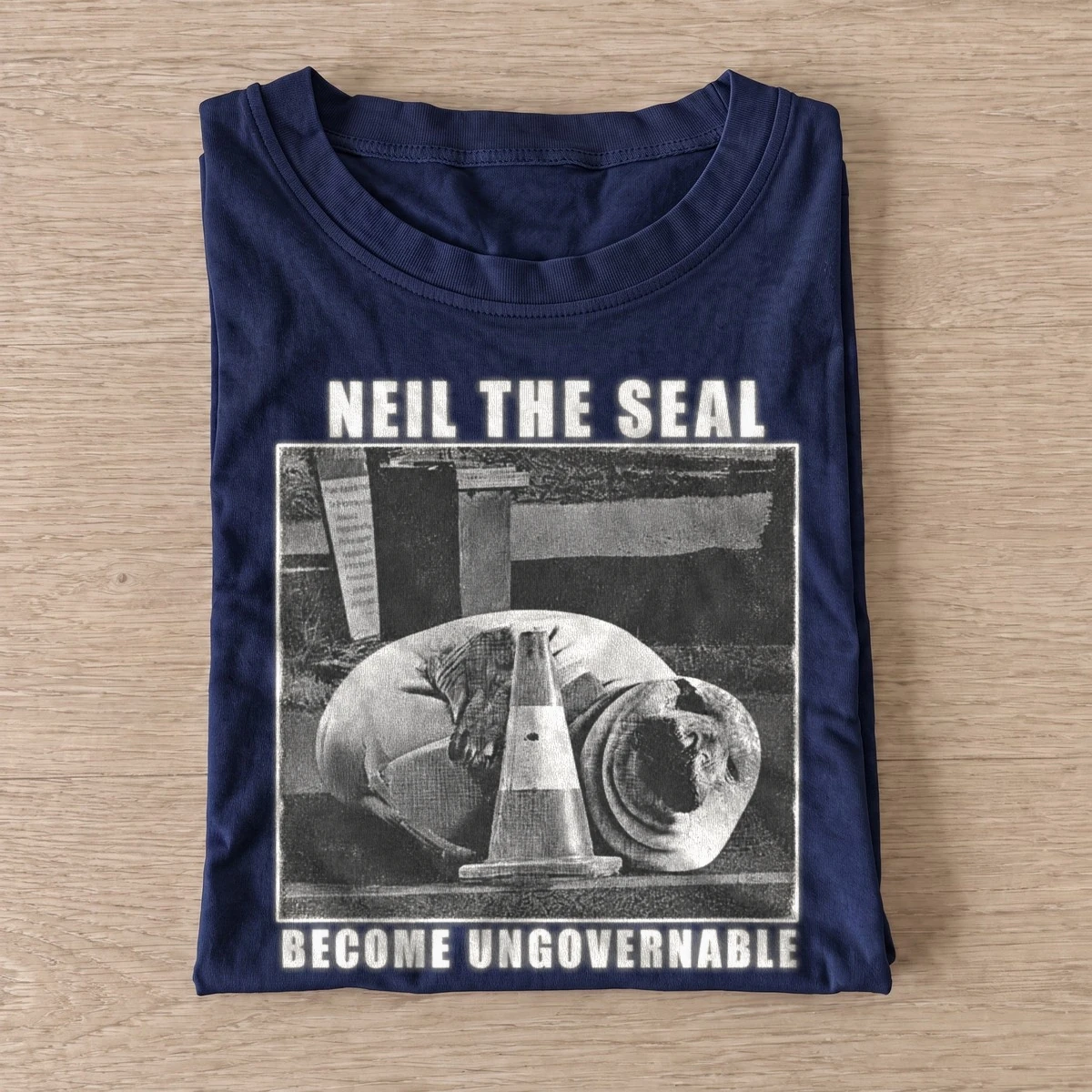 Neil the seal become ungovernable t shirt navy20ungovernable seal.webp