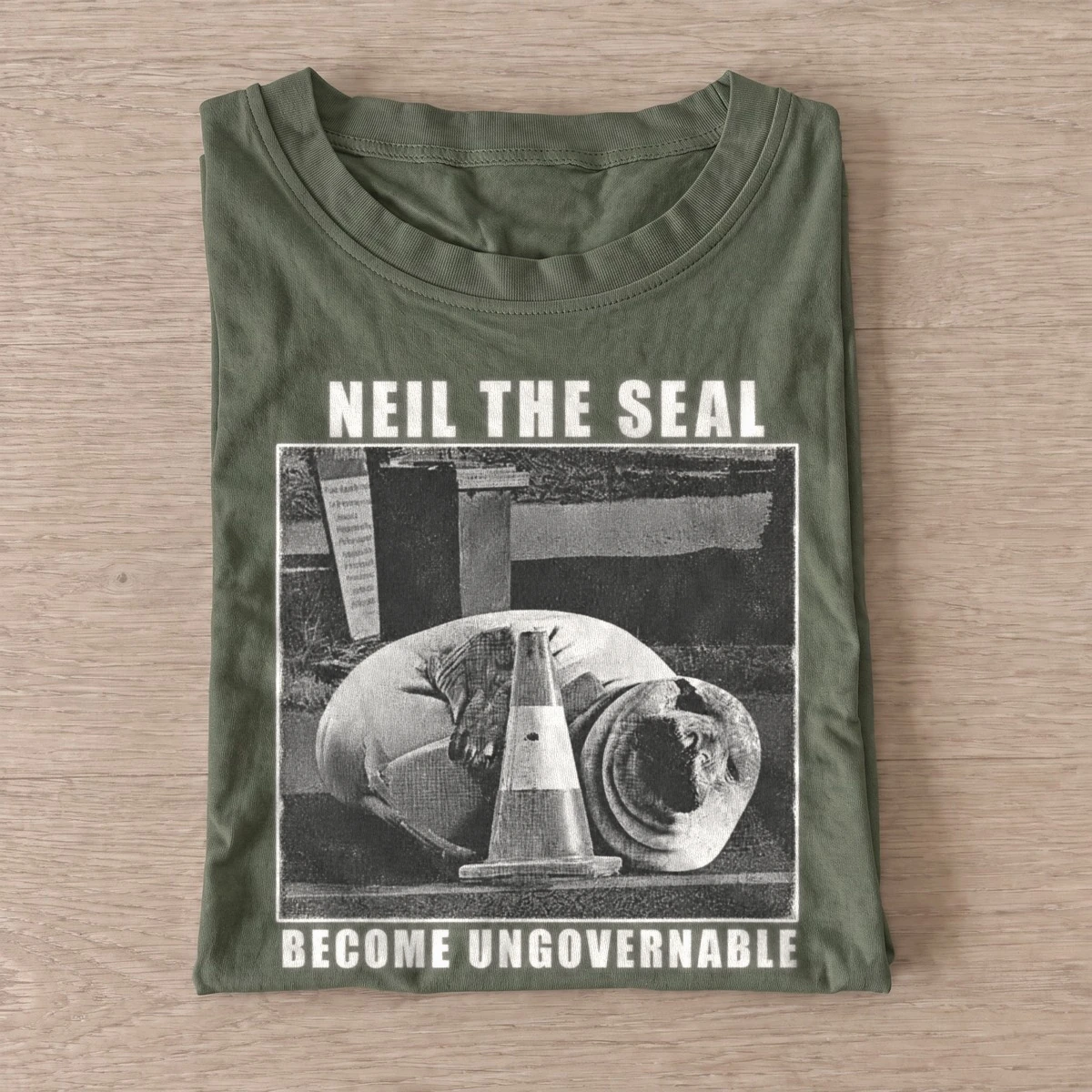 Neil the seal become ungovernable t shirt olive20ungovernable seal.webp