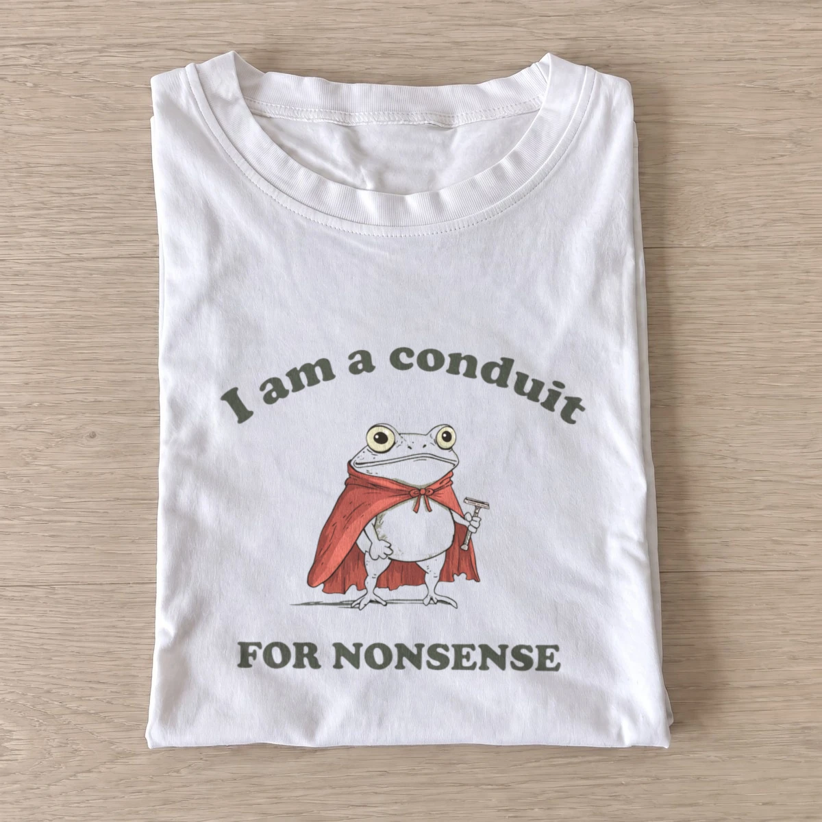 Nonsense caped frog t shirt white20nonsense caped frog.webp