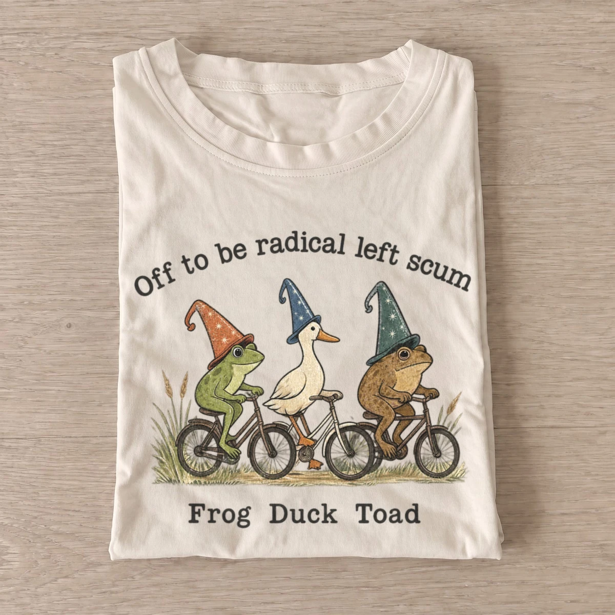 Off to be radical left scum cycling trio t shirt sand20radical cycling trio.webp