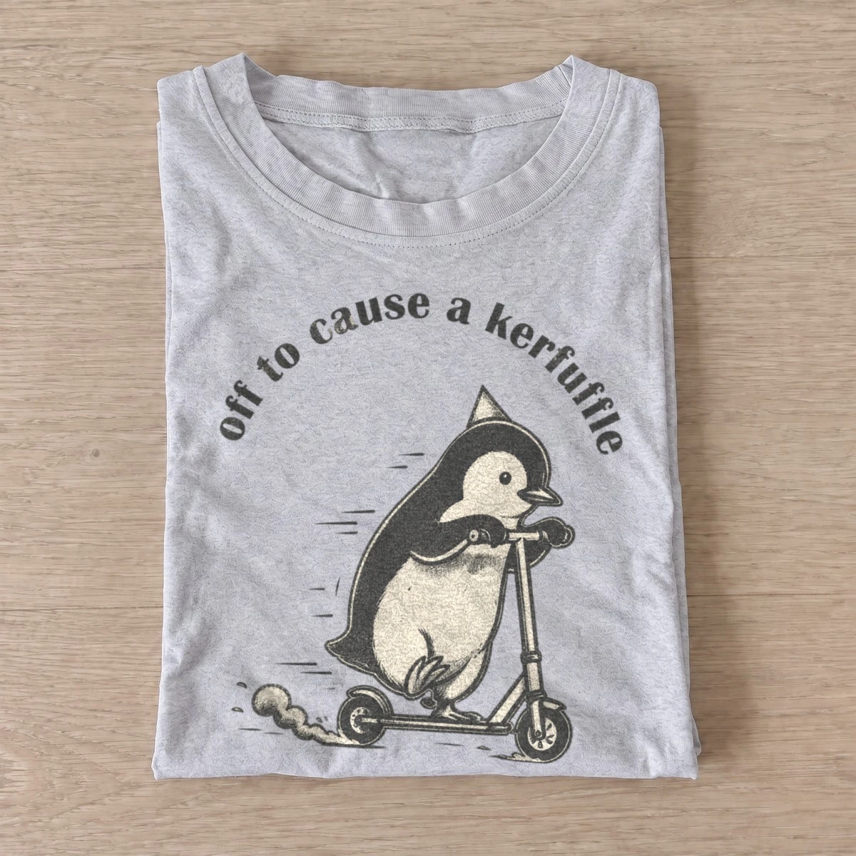 Off to cause a kerfuffle scooter penguin t shirt gray20kerfuffle scooter penguin.webp