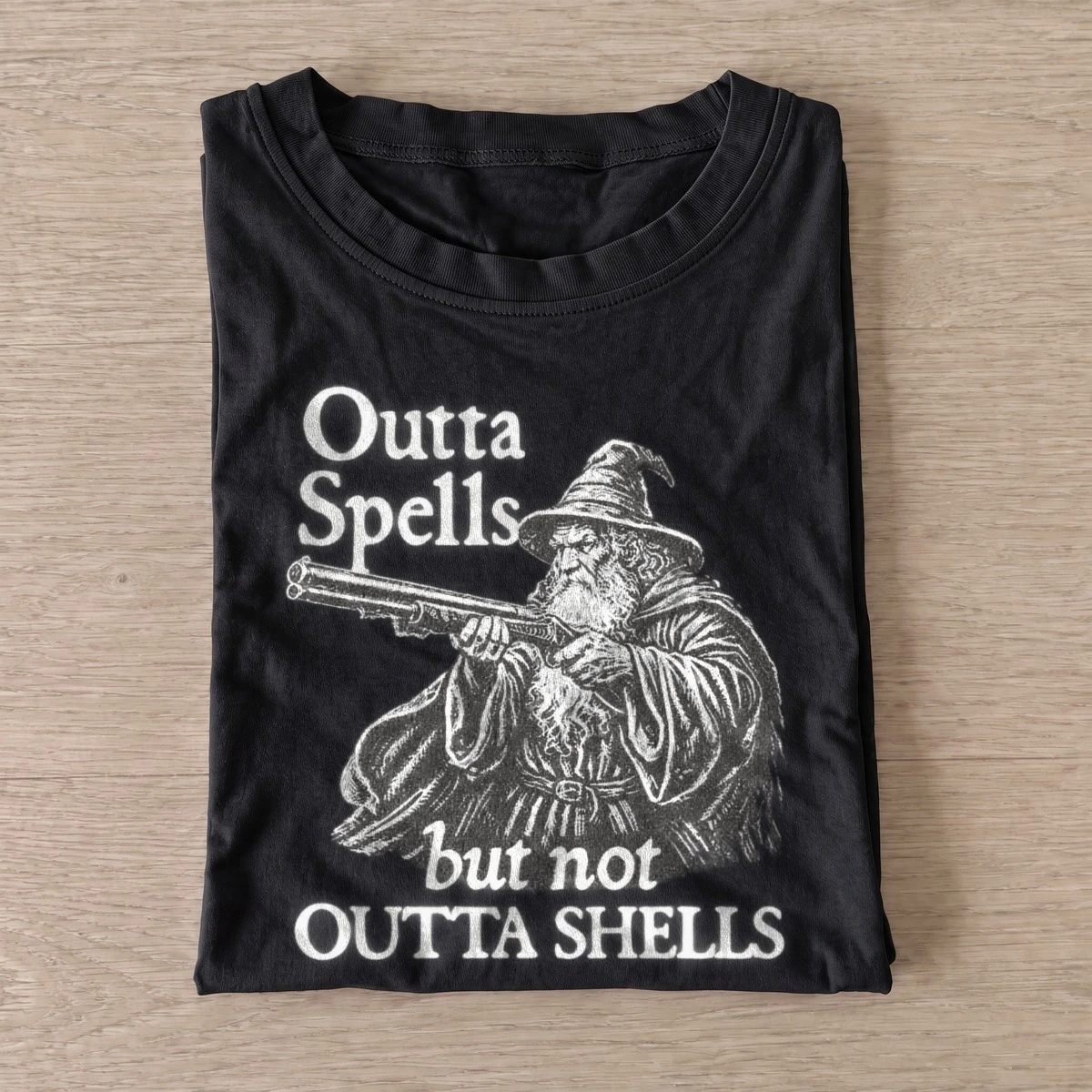 Outta spells but not outta shells wizard t shirt black20wizard with shells.webp