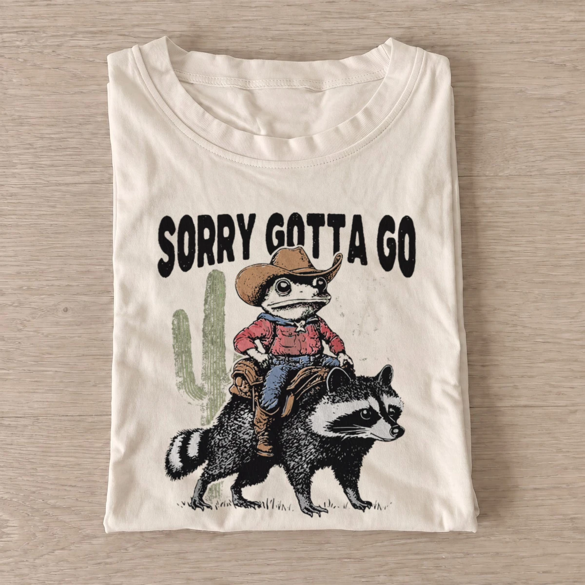 Raccoon riding raccoon t shirt sand20raccoon riding raccoon.webp