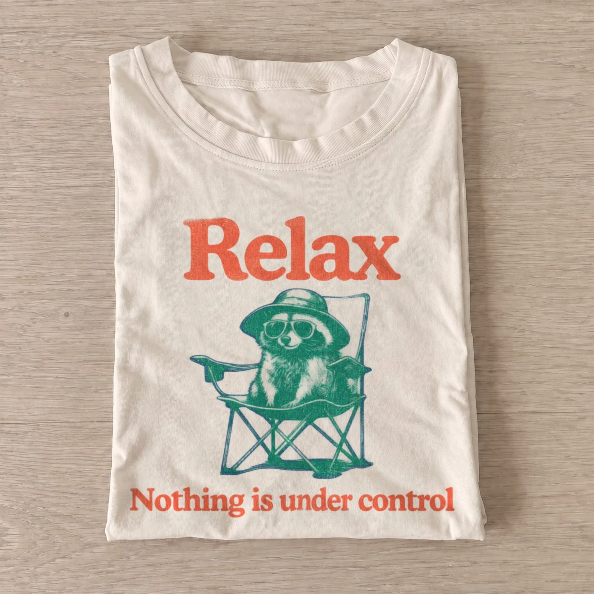Relax nothing is under control raccoon t shirt sand20relax raccoon.webp