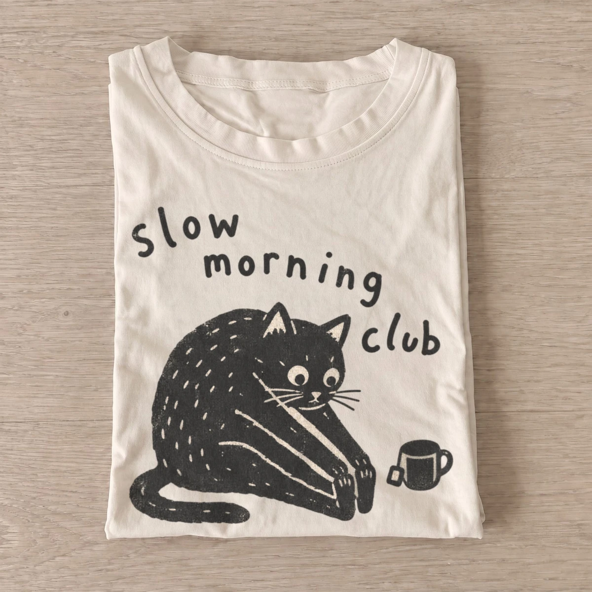 Slow morning club cat t shirt sand20slow morning cat.webp