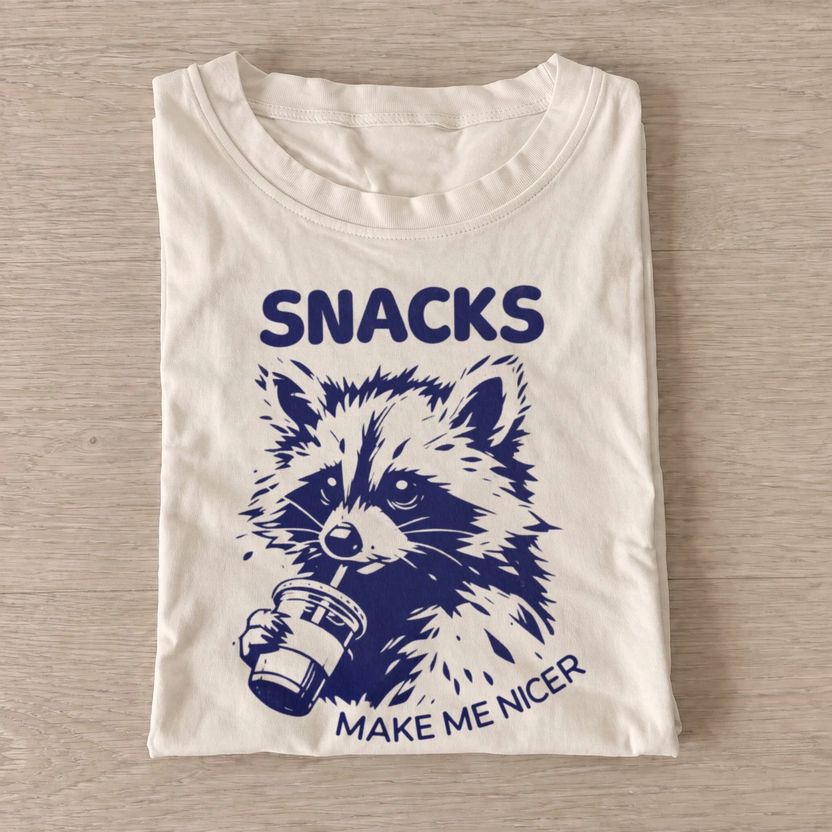 Snacks make me nicer raccoon t shirt sand20snacks help raccoon.webp