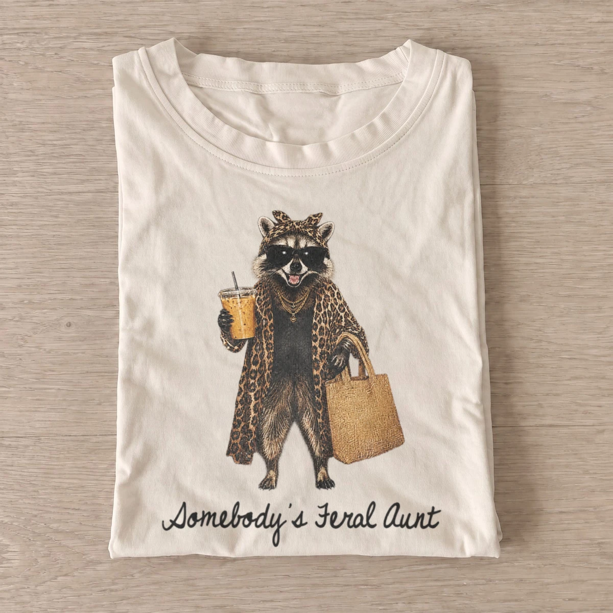 Somebodys feral aunt raccoon t shirt sand20feral aunt queen.webp