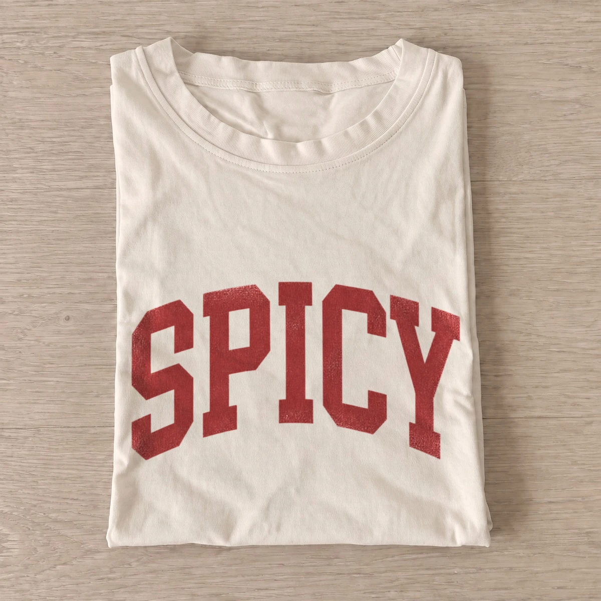 Spicy arched varsity t shirt sand20spicy.webp
