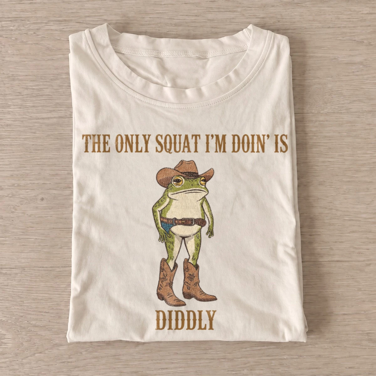 The only squat im doin is diddly cowboy frog t shirt sand20diddly squat cowboy frog.webp