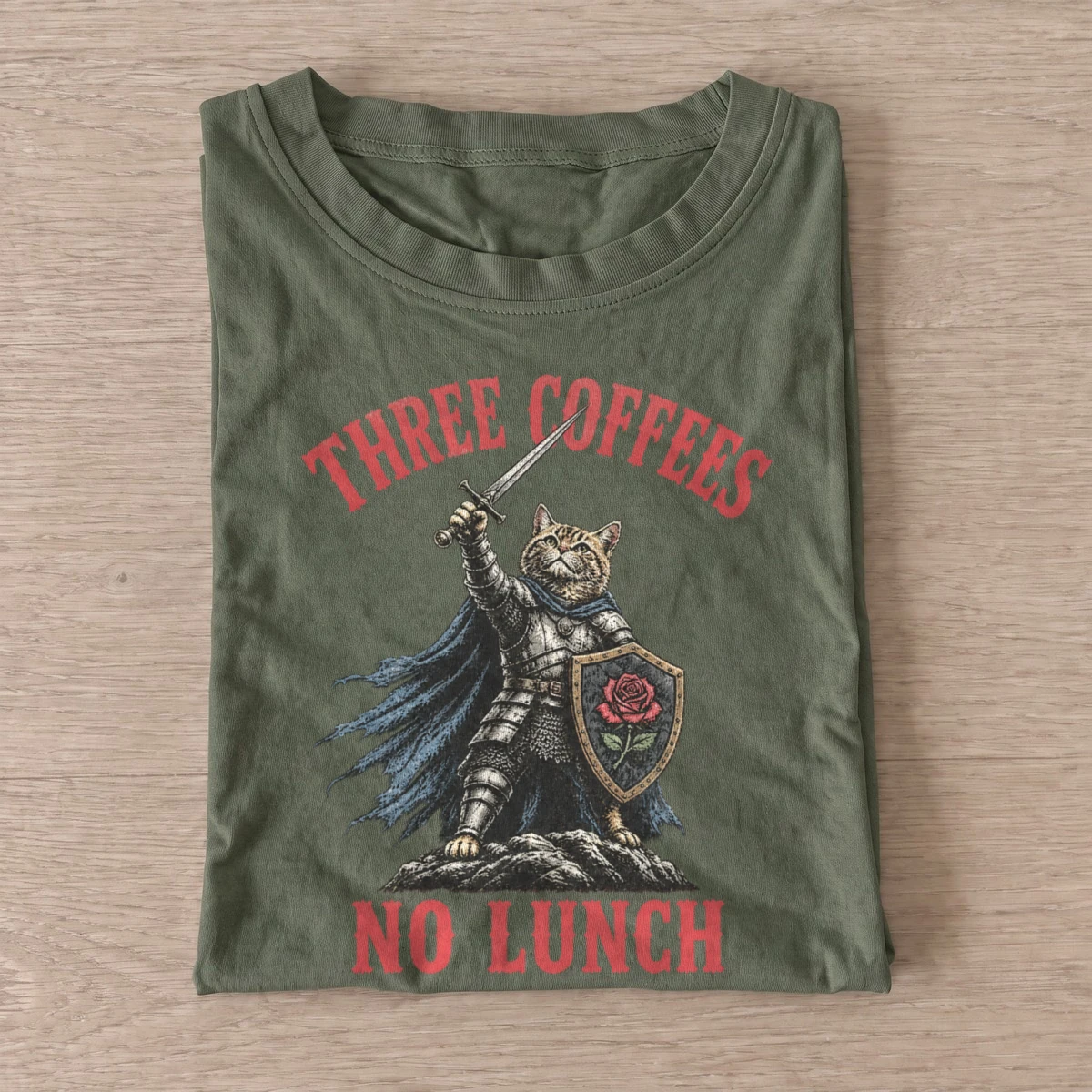 Three coffees no lunch cat knight t shirt olive20coffee fueled cat knight.webp