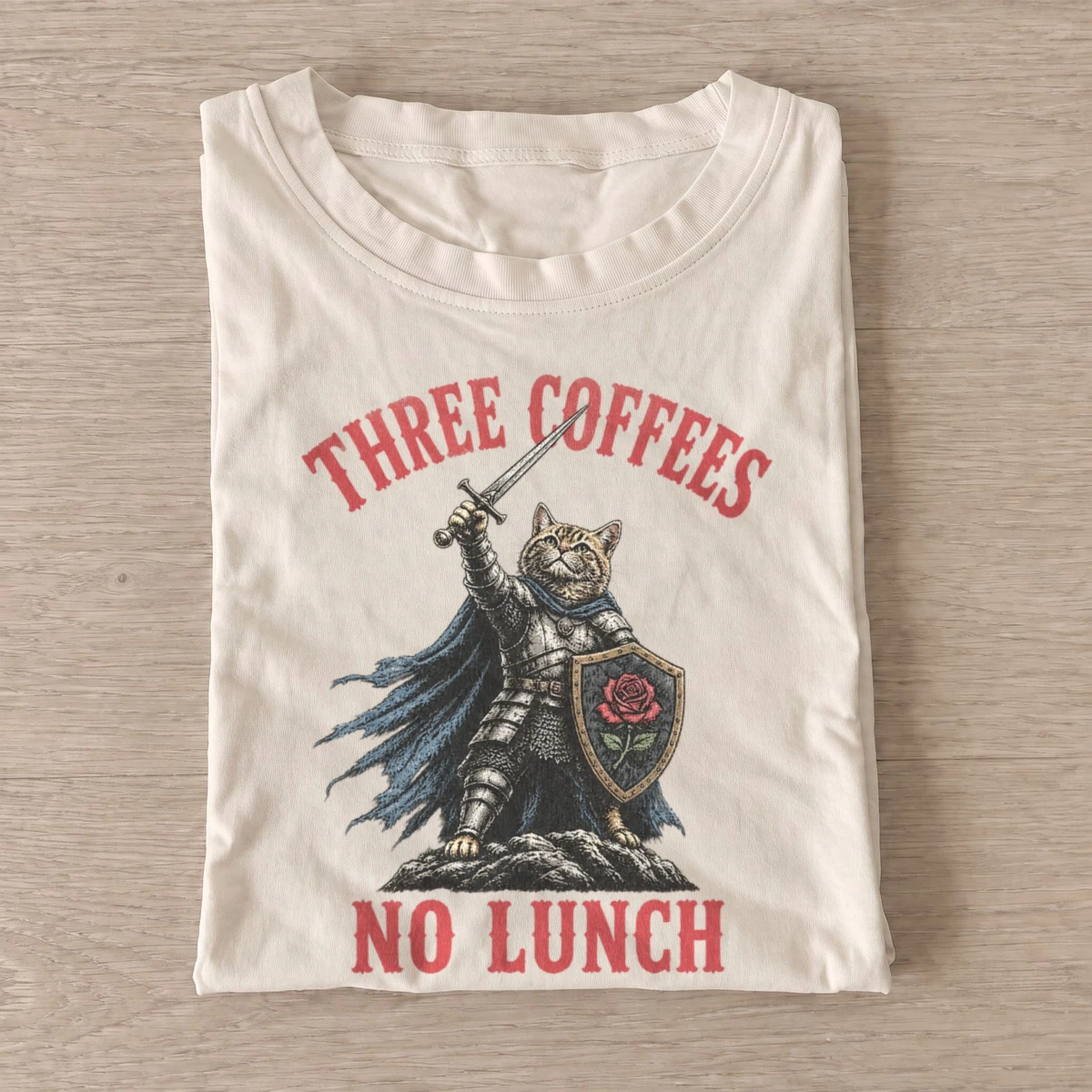 Three coffees no lunch cat knight t shirt sand20coffee fueled cat knight.webp