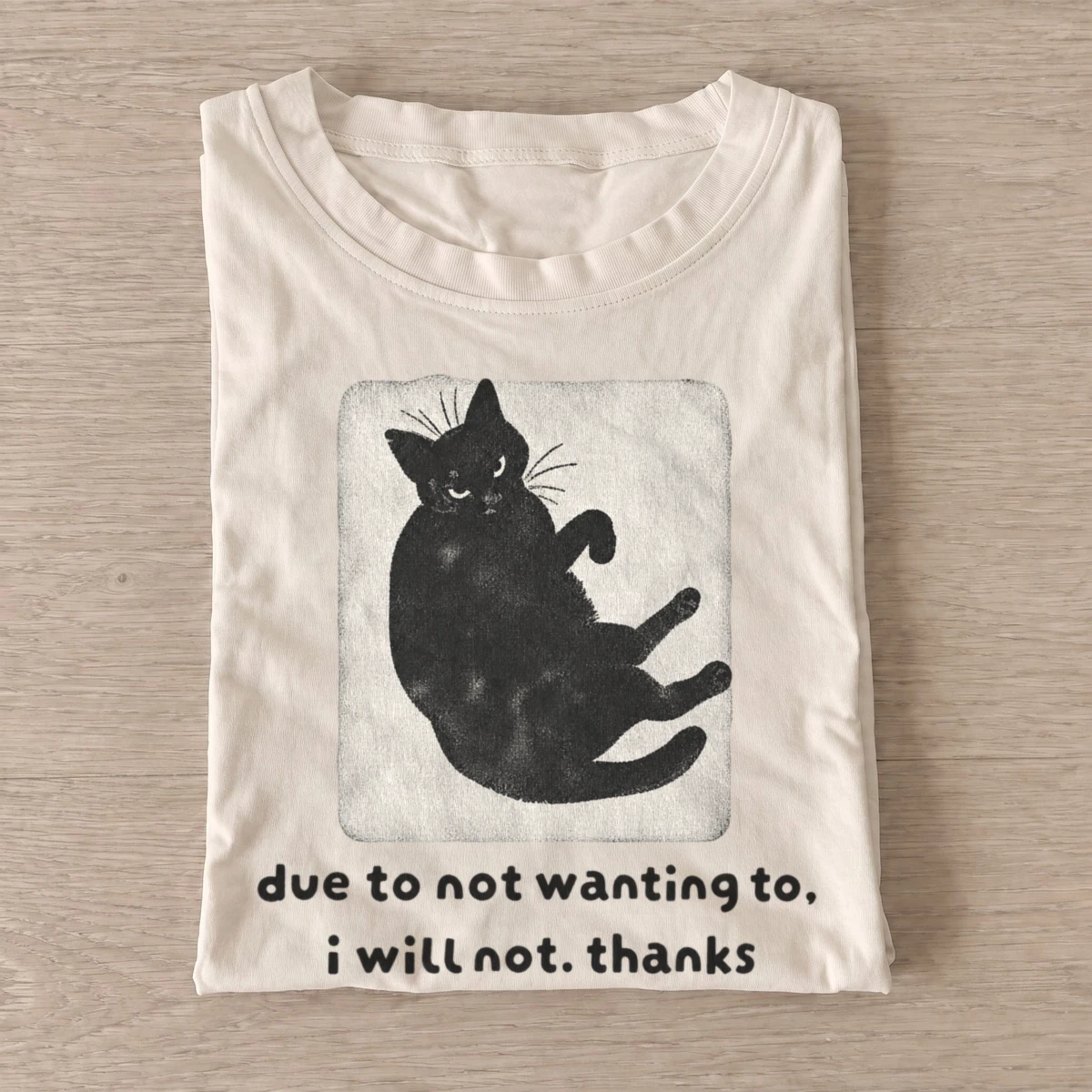 Unwilling black cat due to not wanting to t shirt sand20unwilling black cat.webp