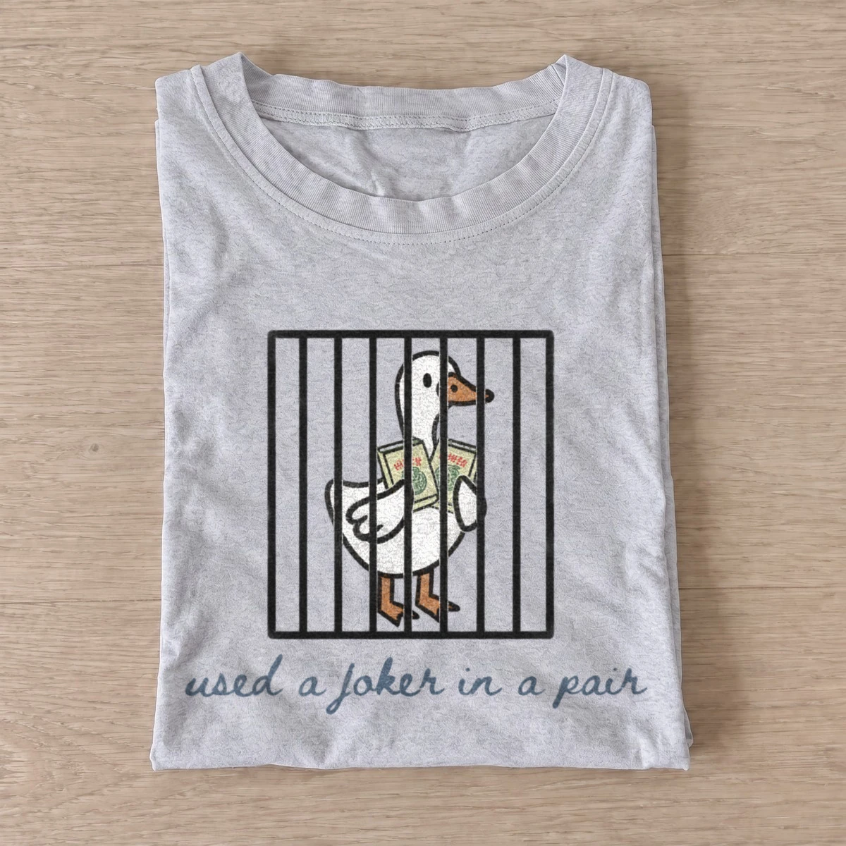Used a joker in a pair jailed goose t shirt gray20jailed joker goose.webp