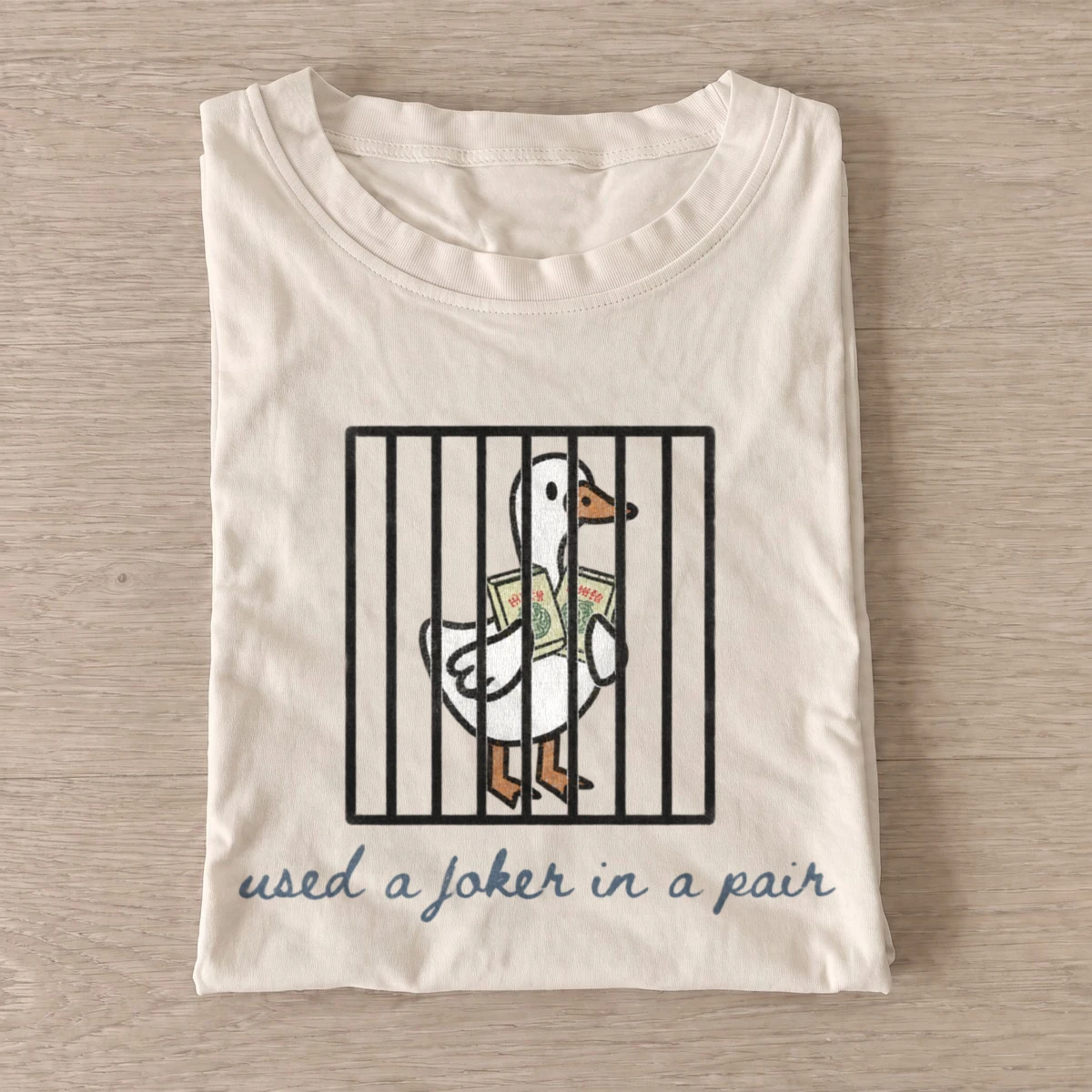 Used a joker in a pair jailed goose t shirt sand20jailed joker goose.webp