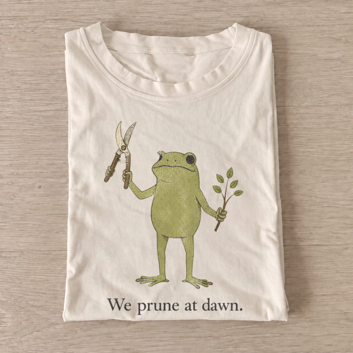 We prune at dawn gardening frog t shirt sand20prune at dawn.webp