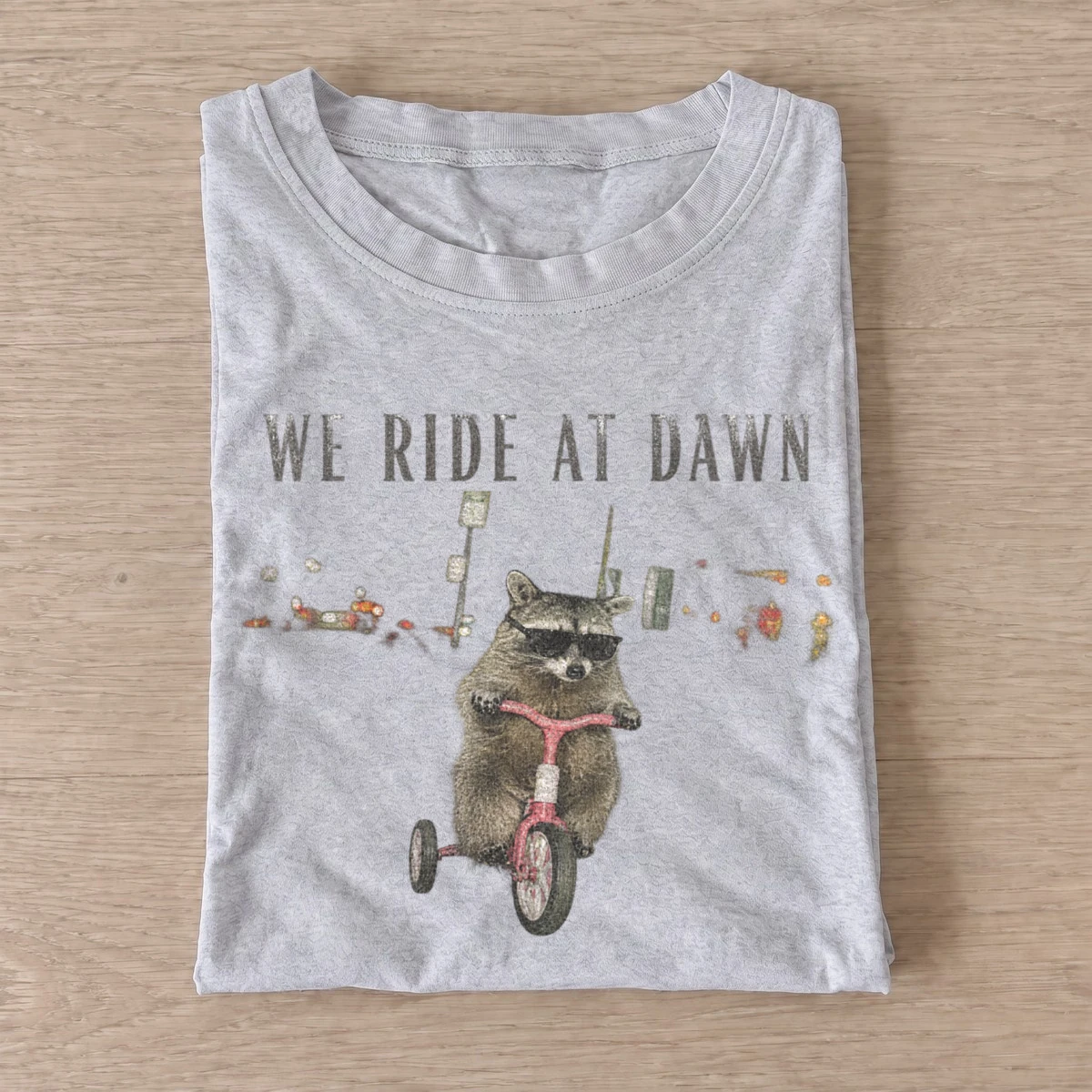 We ride at dawn raccoon t shirt gray20ride at dawn raccoon.webp