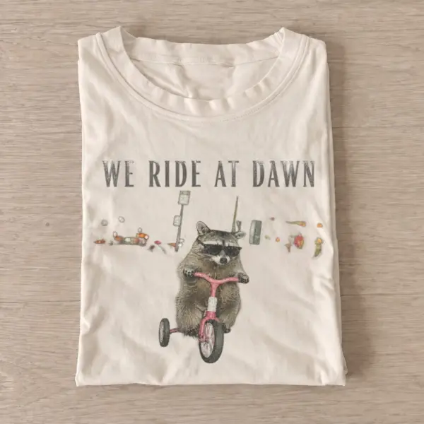We ride at dawn raccoon t shirt sand20ride at dawn raccoon.webp
