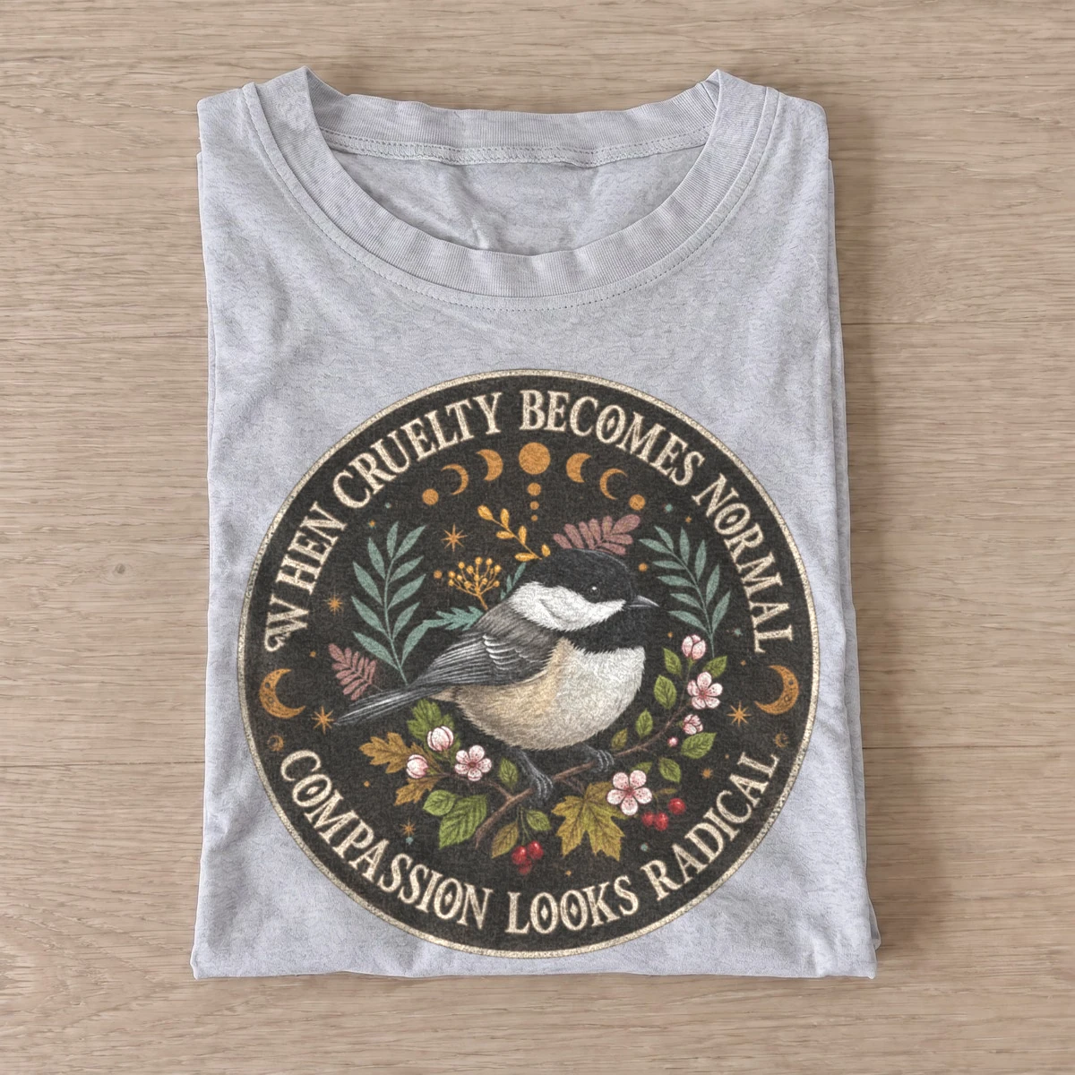 When cruelty becomes normal compassion looks radical bird t shirt gray20radical compassion bird.webp