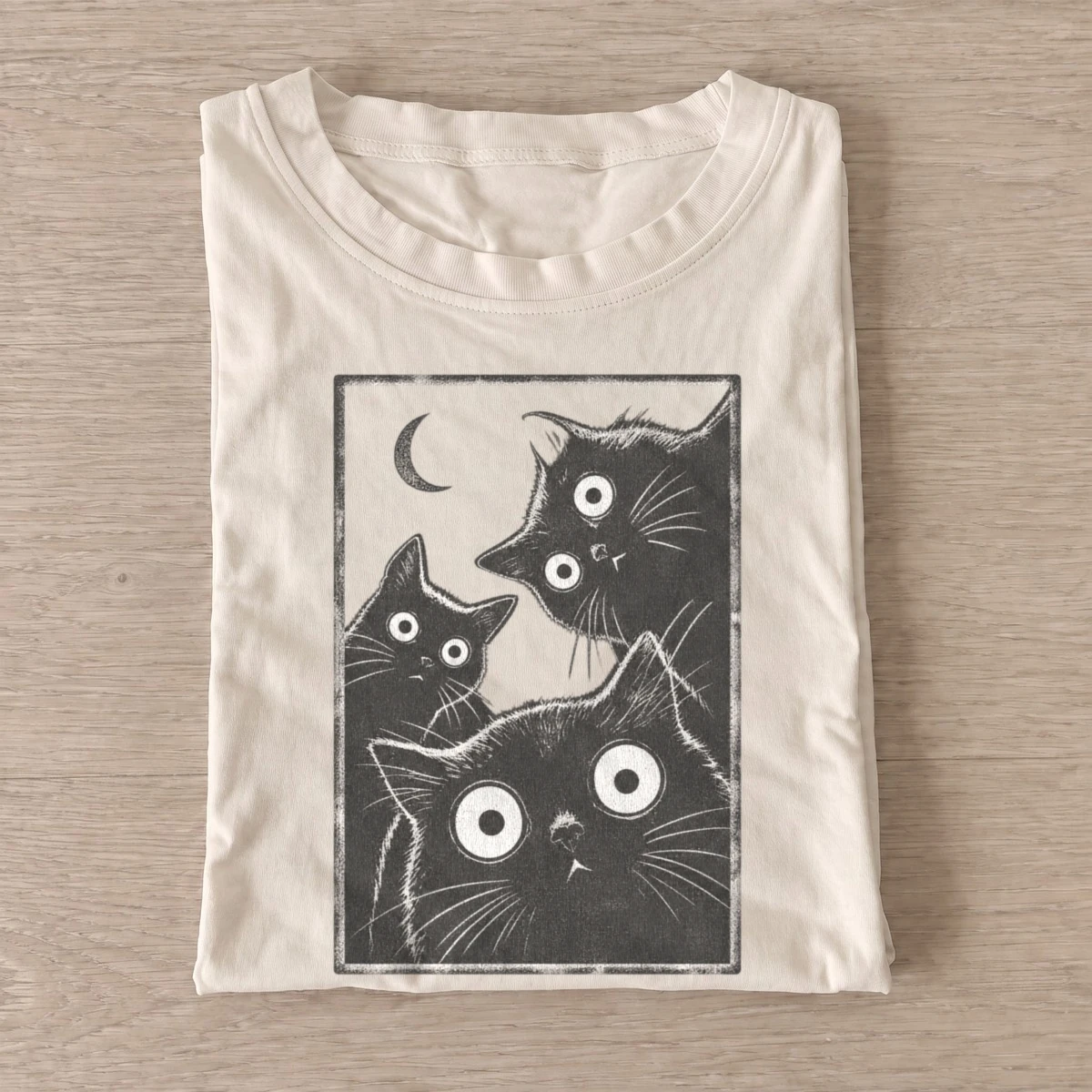Wide eyed cat trio graphic t shirt sand20wide eyed cat trio.webp