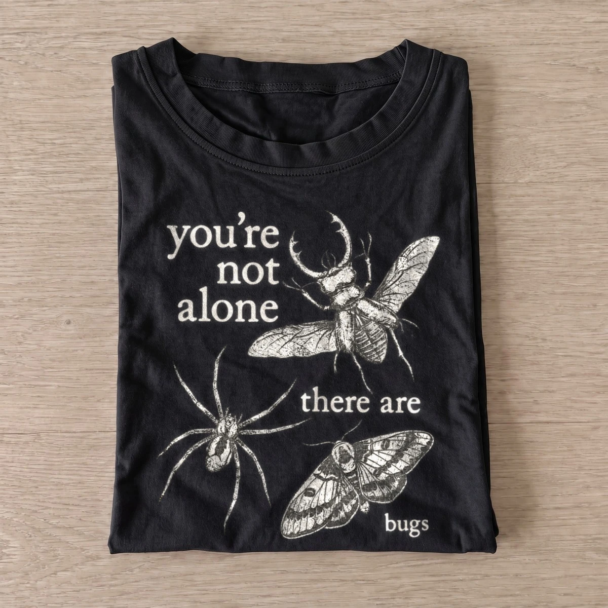 Youre not alone there are bugs t shirt black20never alone bugs.webp