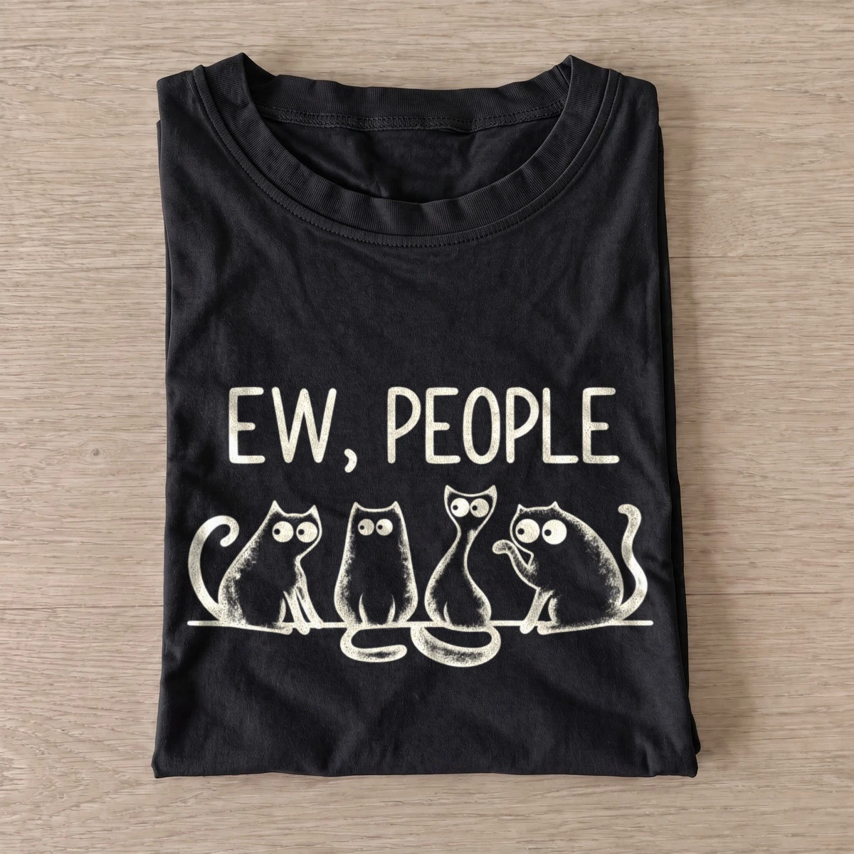 Black Ew People Cat Squad T-shirt with three wide-eyed cats beneath EW, PEOPLE lettering